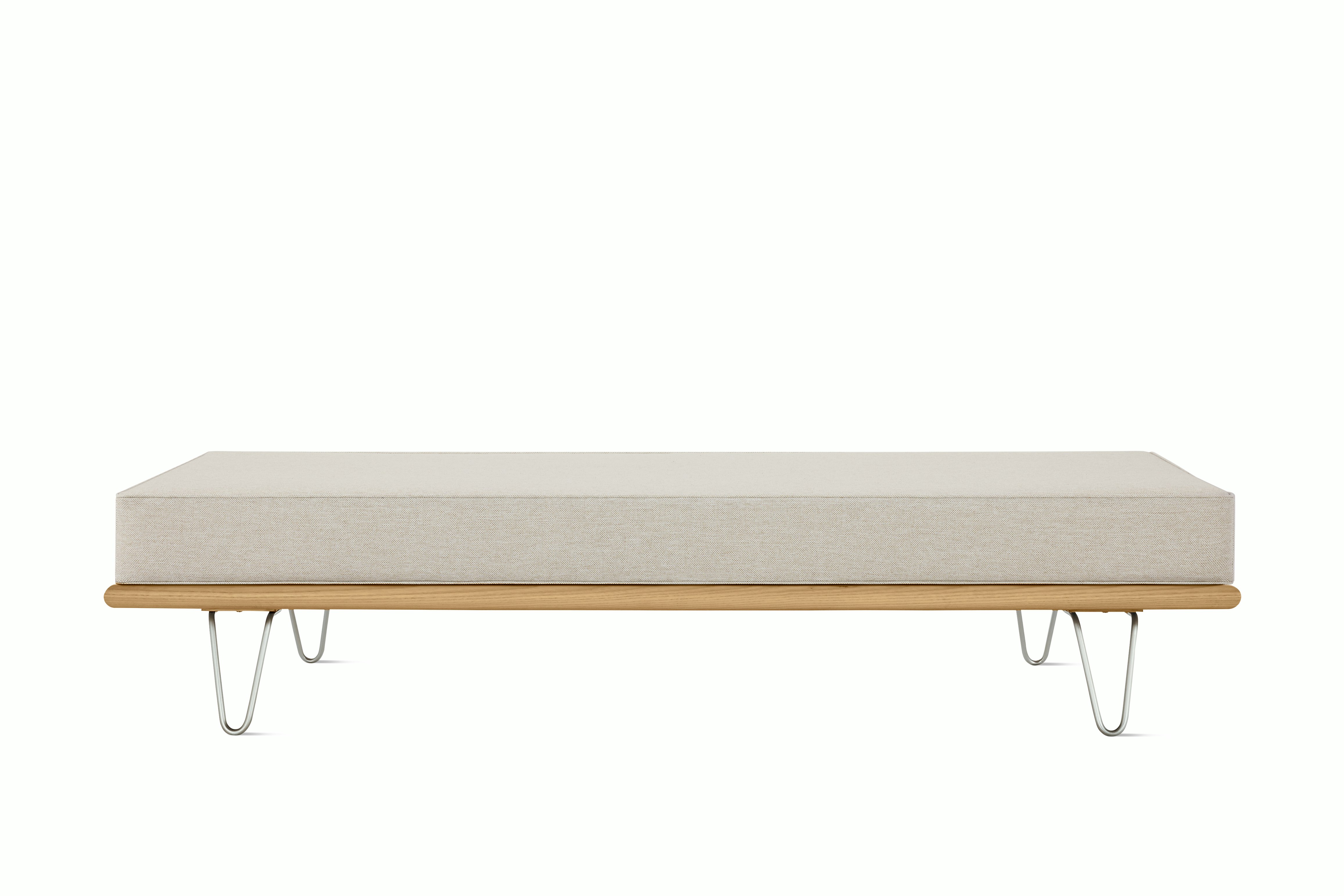 A Nelson Daybed in oak shell viewed from the front.