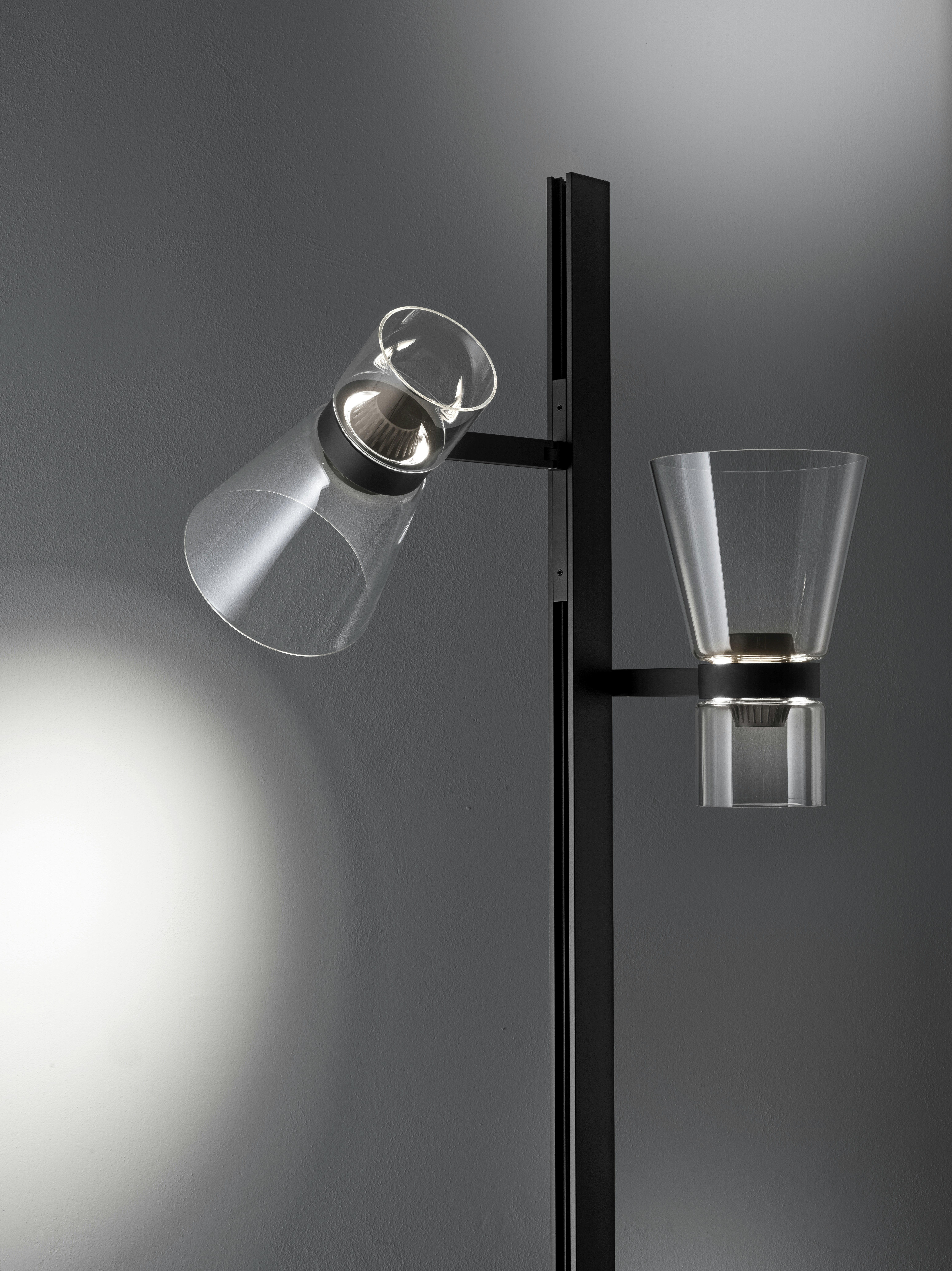 An environmental shot of Nocturne Floor Lamp in F2 Cone, Black.
