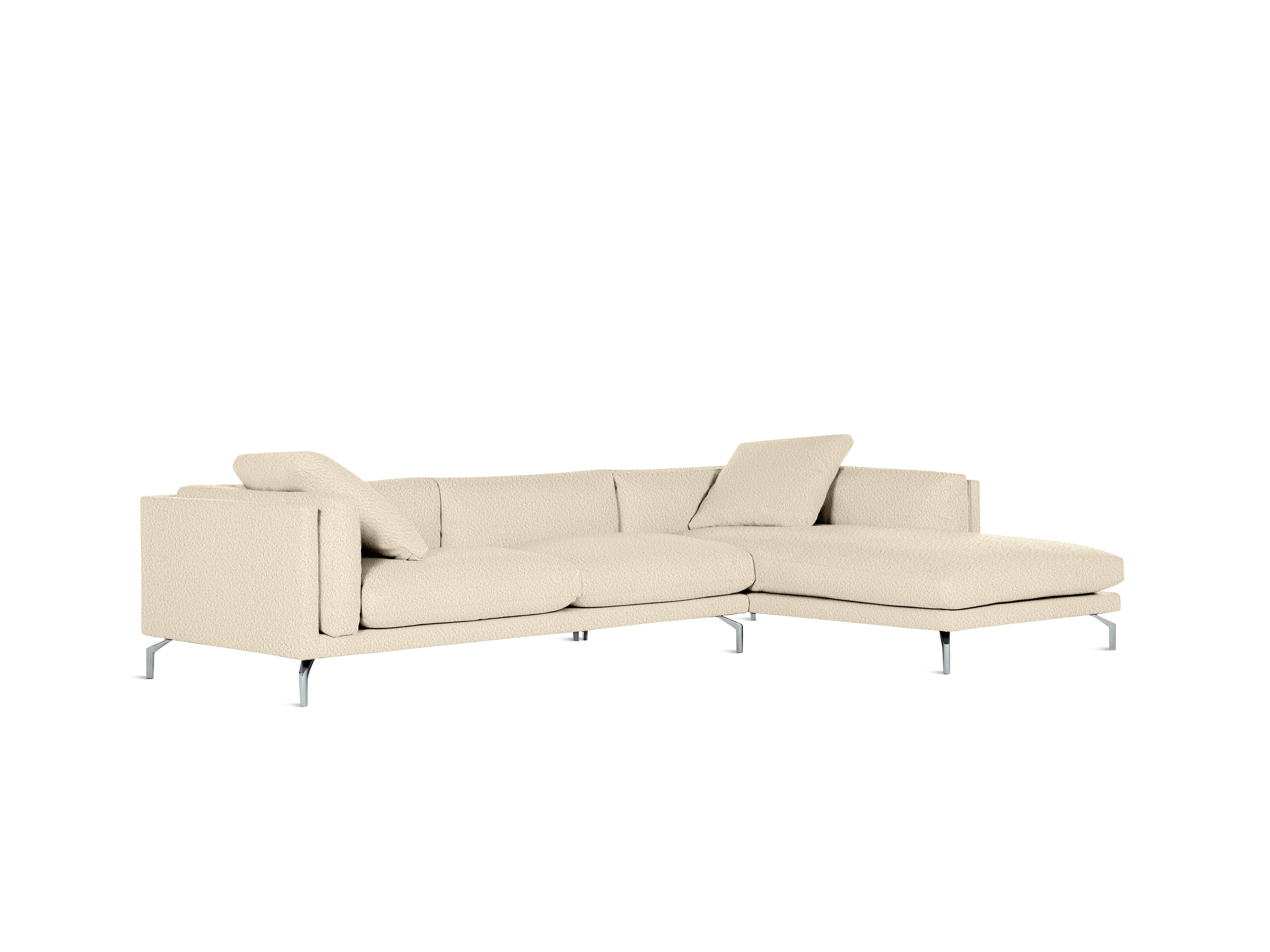 A Como Sectional Sofa in Cream viewed from an angle.