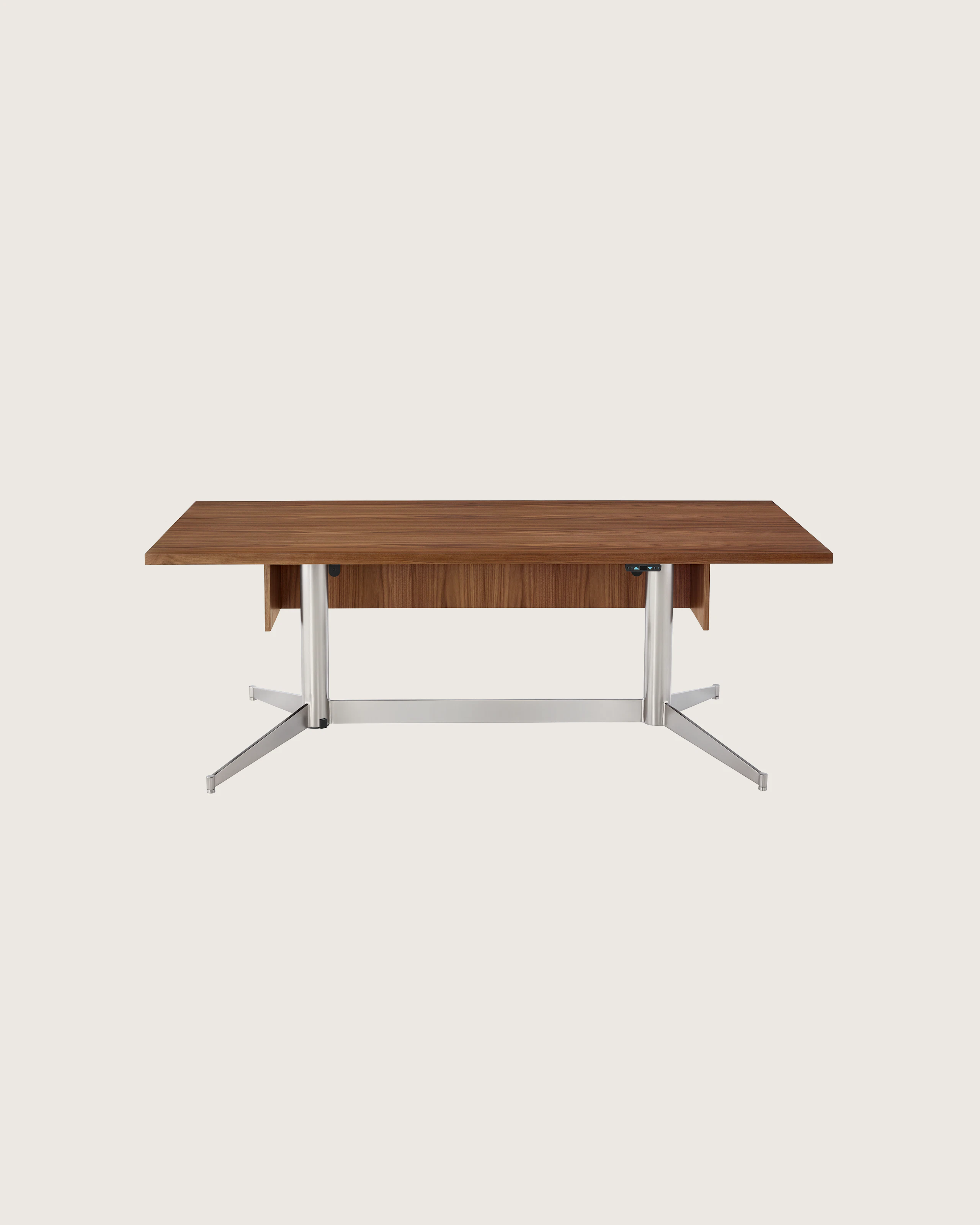 A rectangular MP Height-Adjustable Table in the seated position, viewed from the front and showing the height-adjustment button beneath the tabletop.