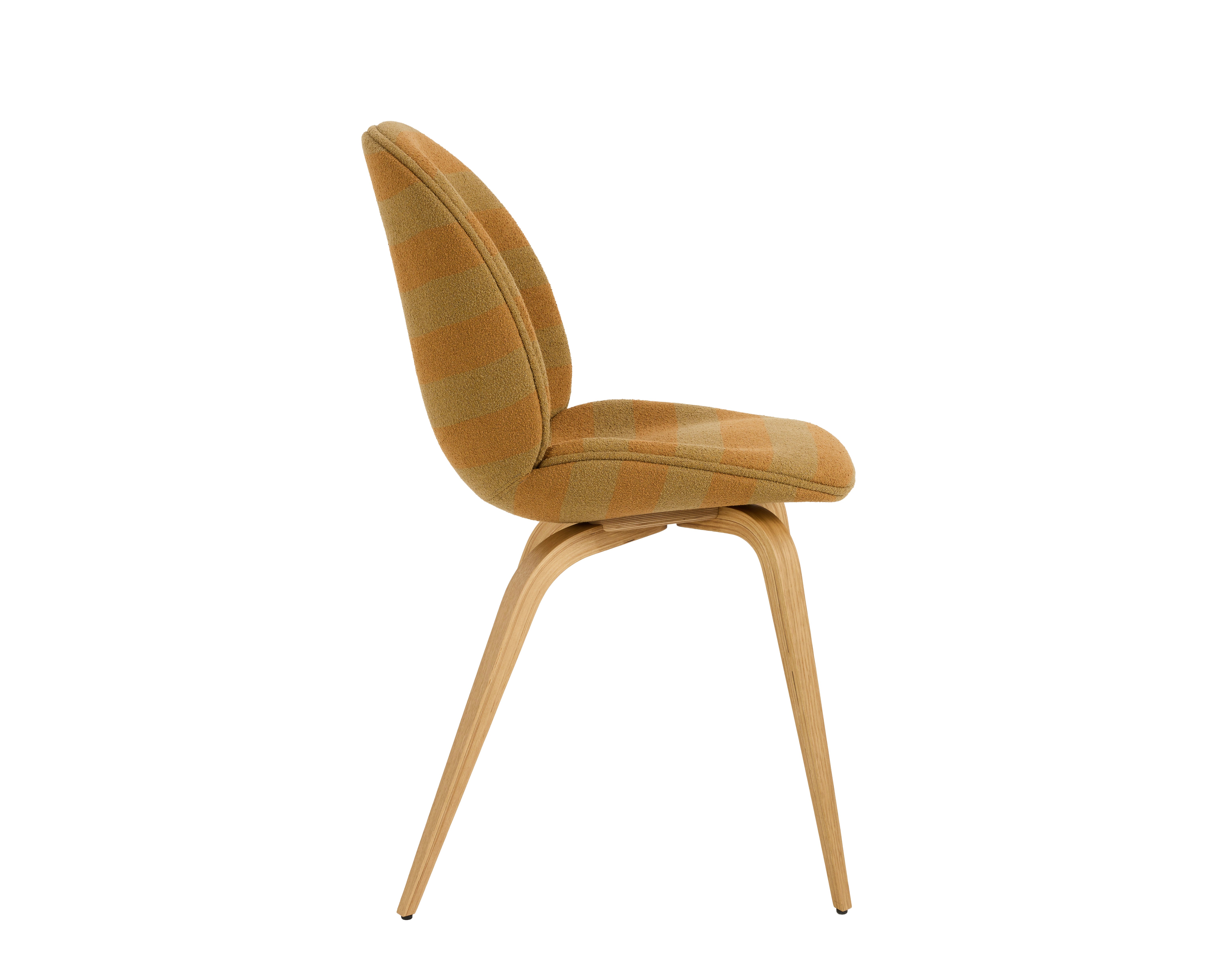 A Beetle Side Chair in sienna sand viewed from the side.
