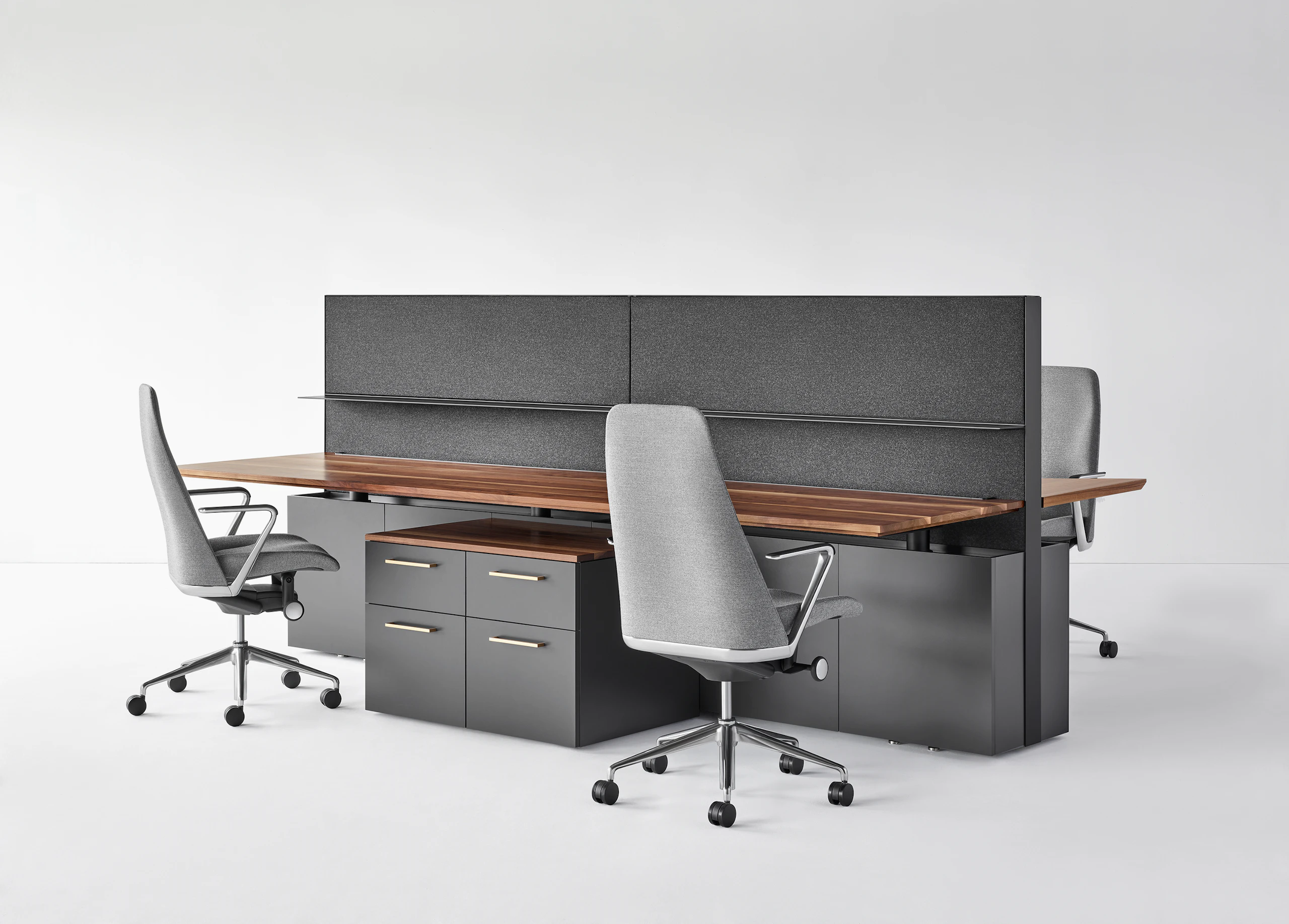A four-pack bench system featuring Geiger One Casegoods and Taper Chairs.