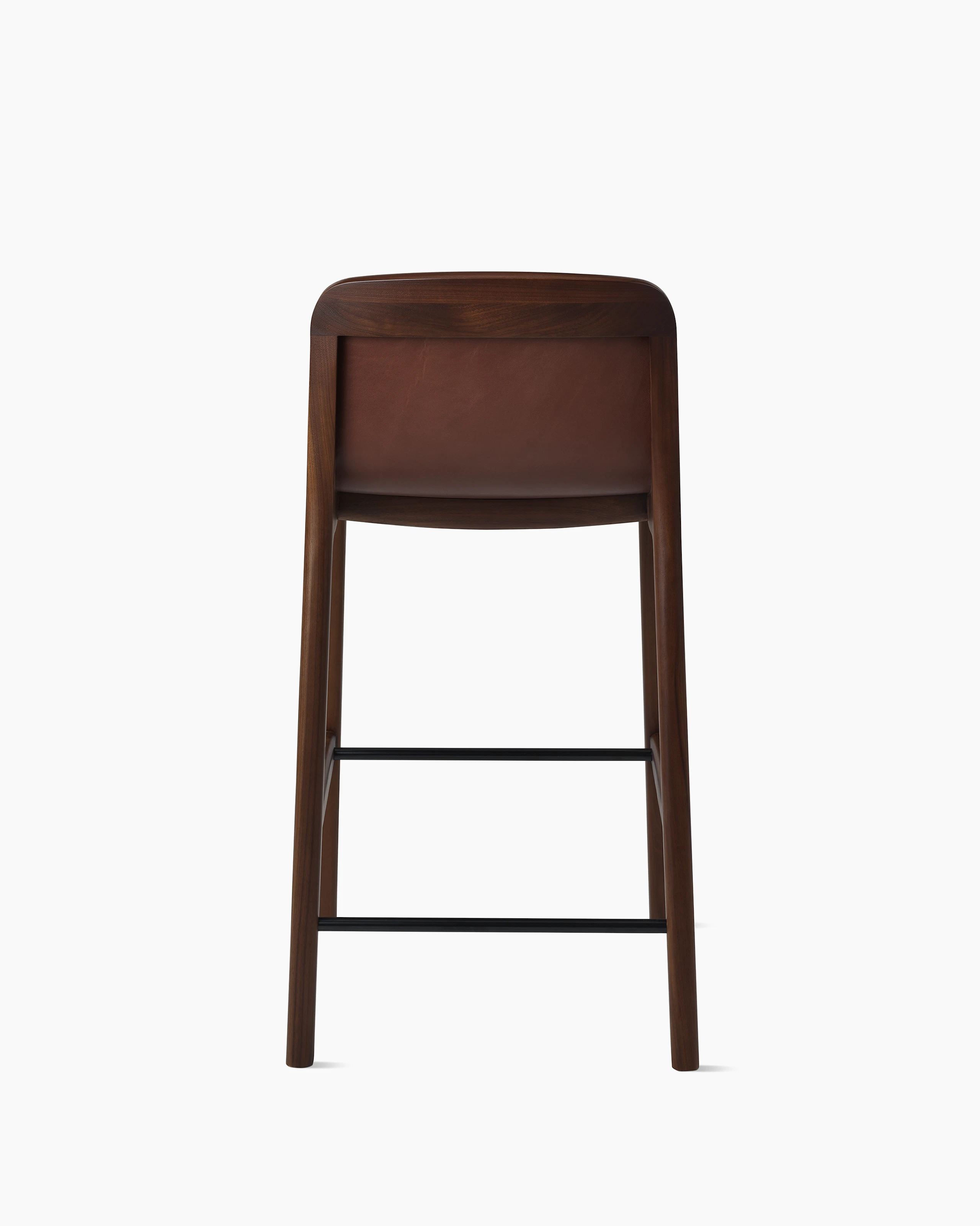 Lijn Stool by Carole Baijings for Geiger in Persian Walnut frame upholstered with Maharam Hue Leather in Bittersweet, back view on a white sweep.