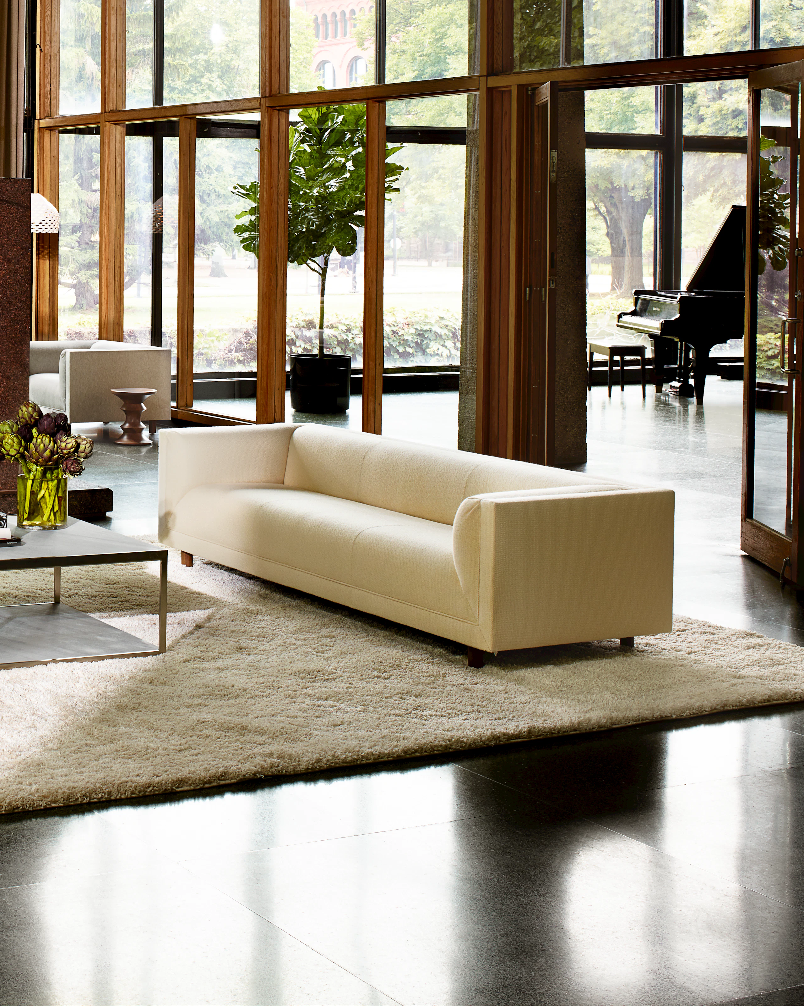 Collection Locations 2013 shot by Francois Dischinger, Rolled Arm Sofa with an H Frame table in a community setting.