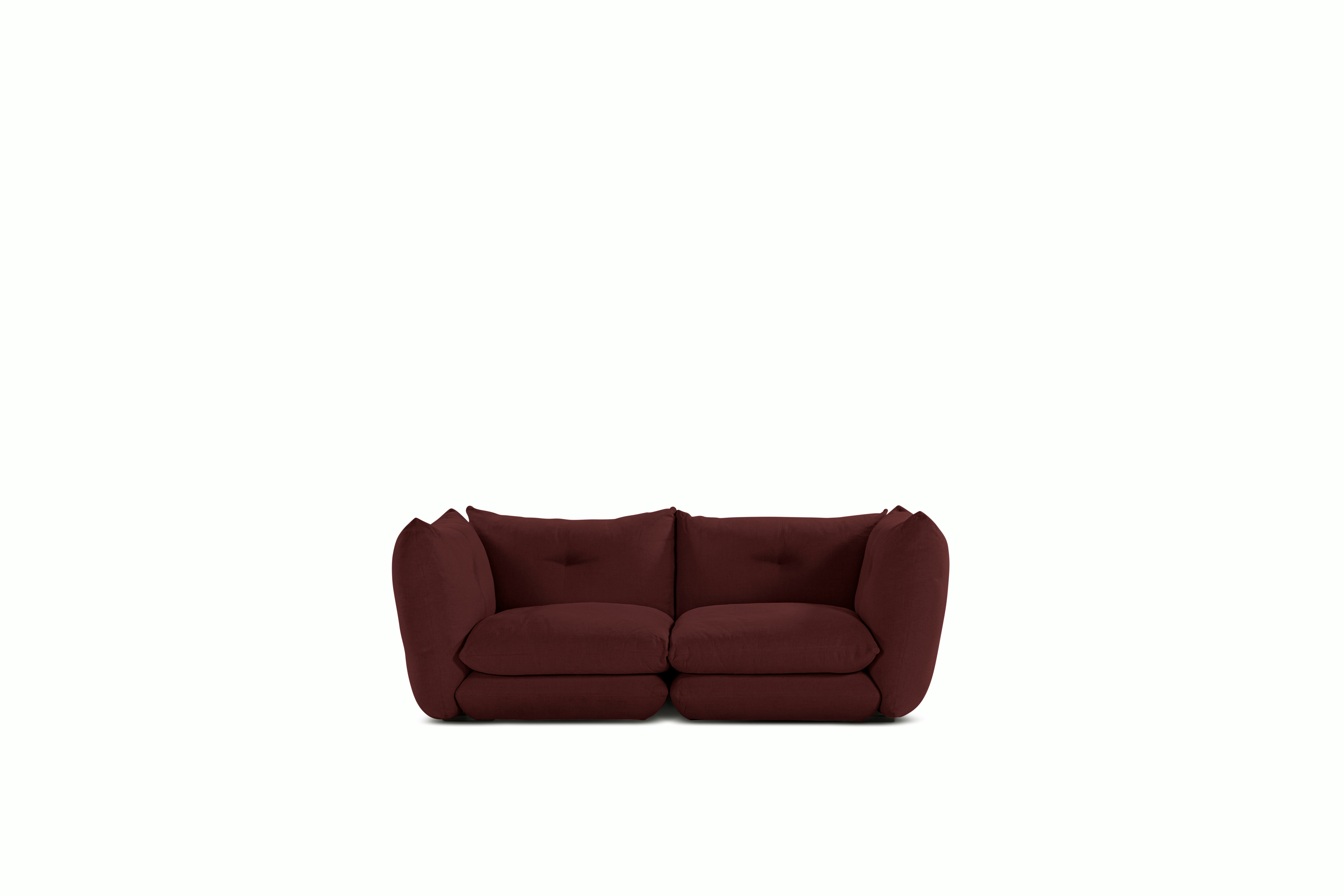 A Perron Pillo Sofa in Garnet viewed from the front.