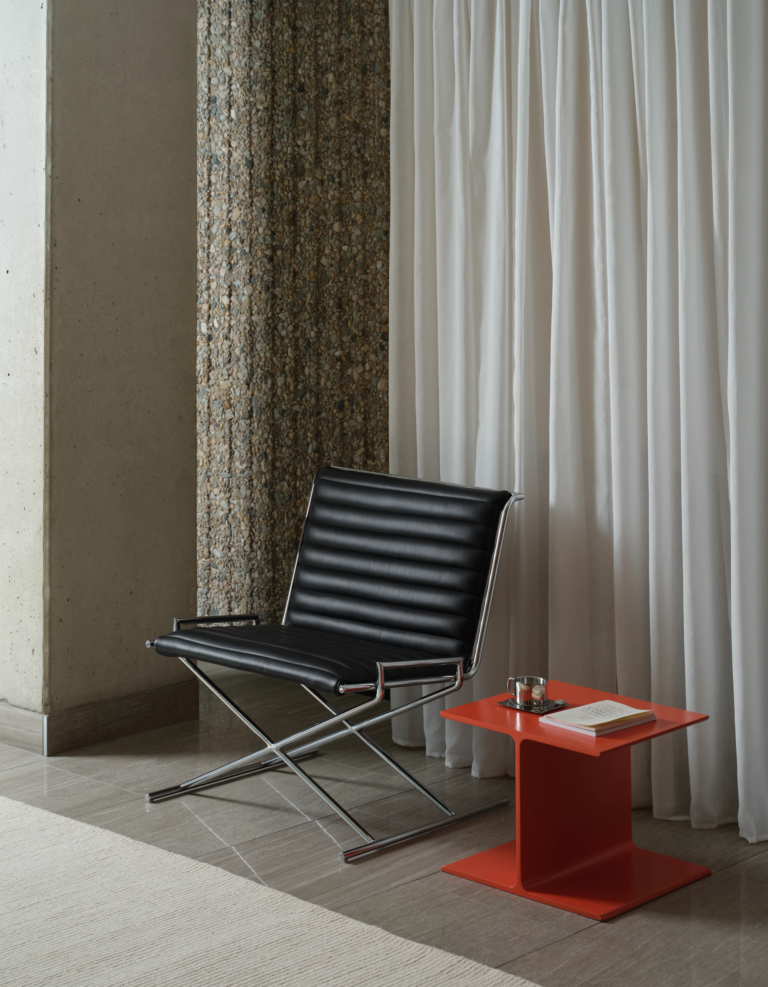 Sled Chair with I Beam table in orange.