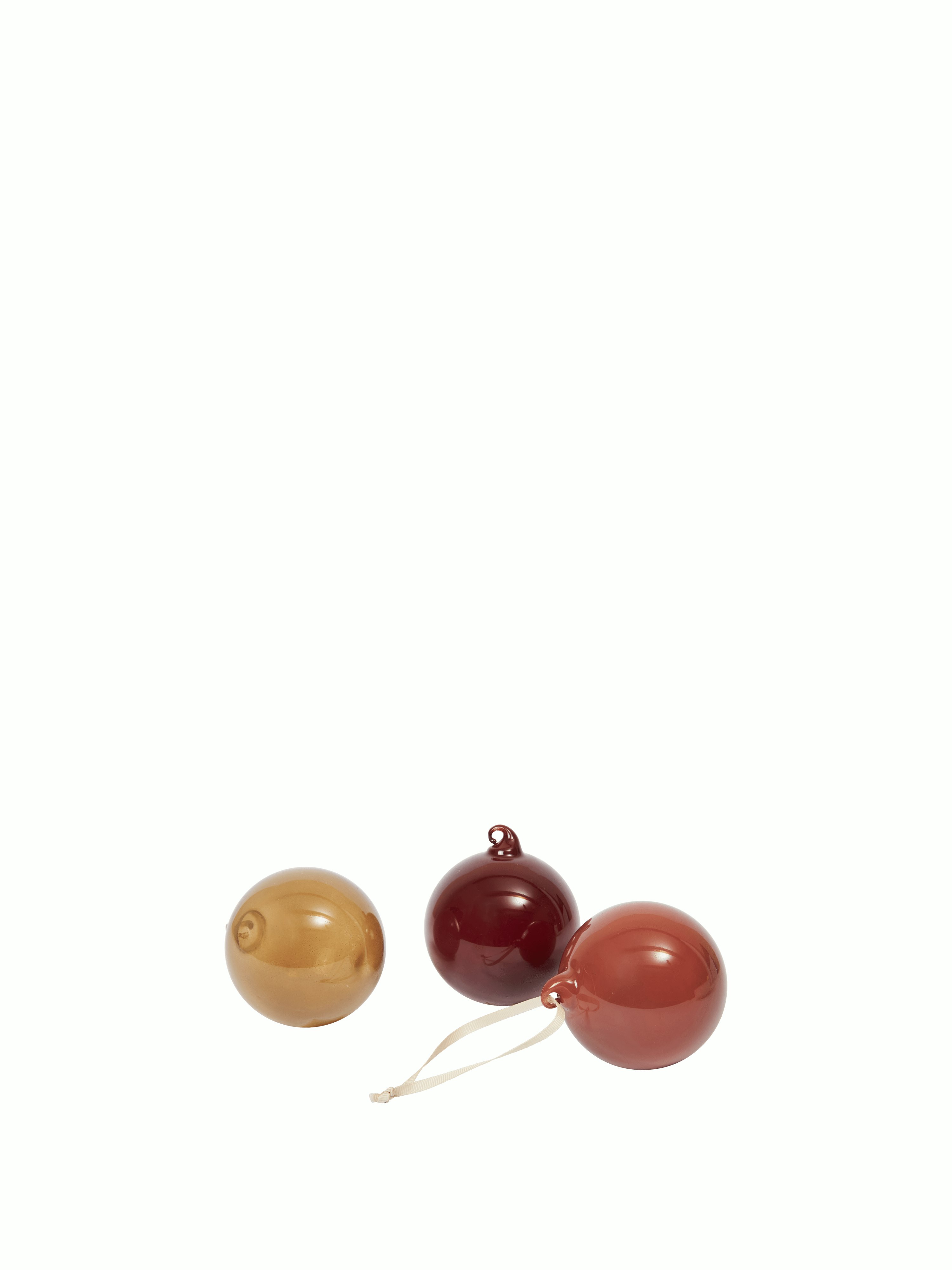 A Glass Baubles, Set of 3 in Small, Roseate Opaque viewed from the front.