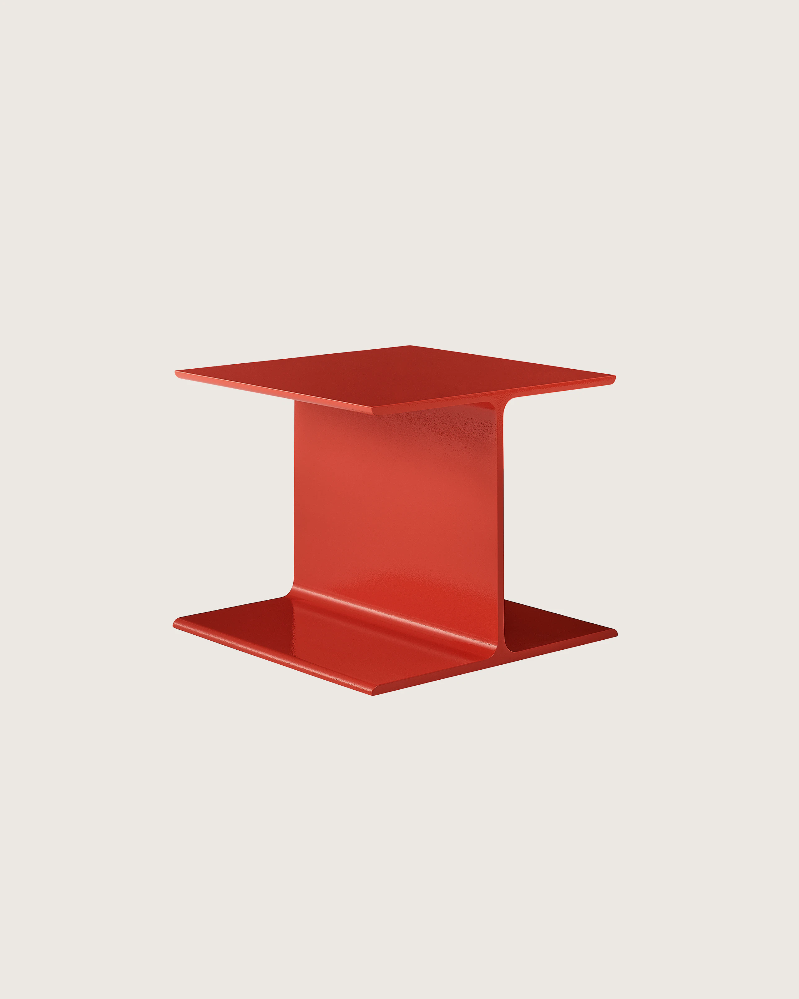 I Beam Side Table designed by Ward Bennett in International Orange, shown at a front angle on a white sweep.