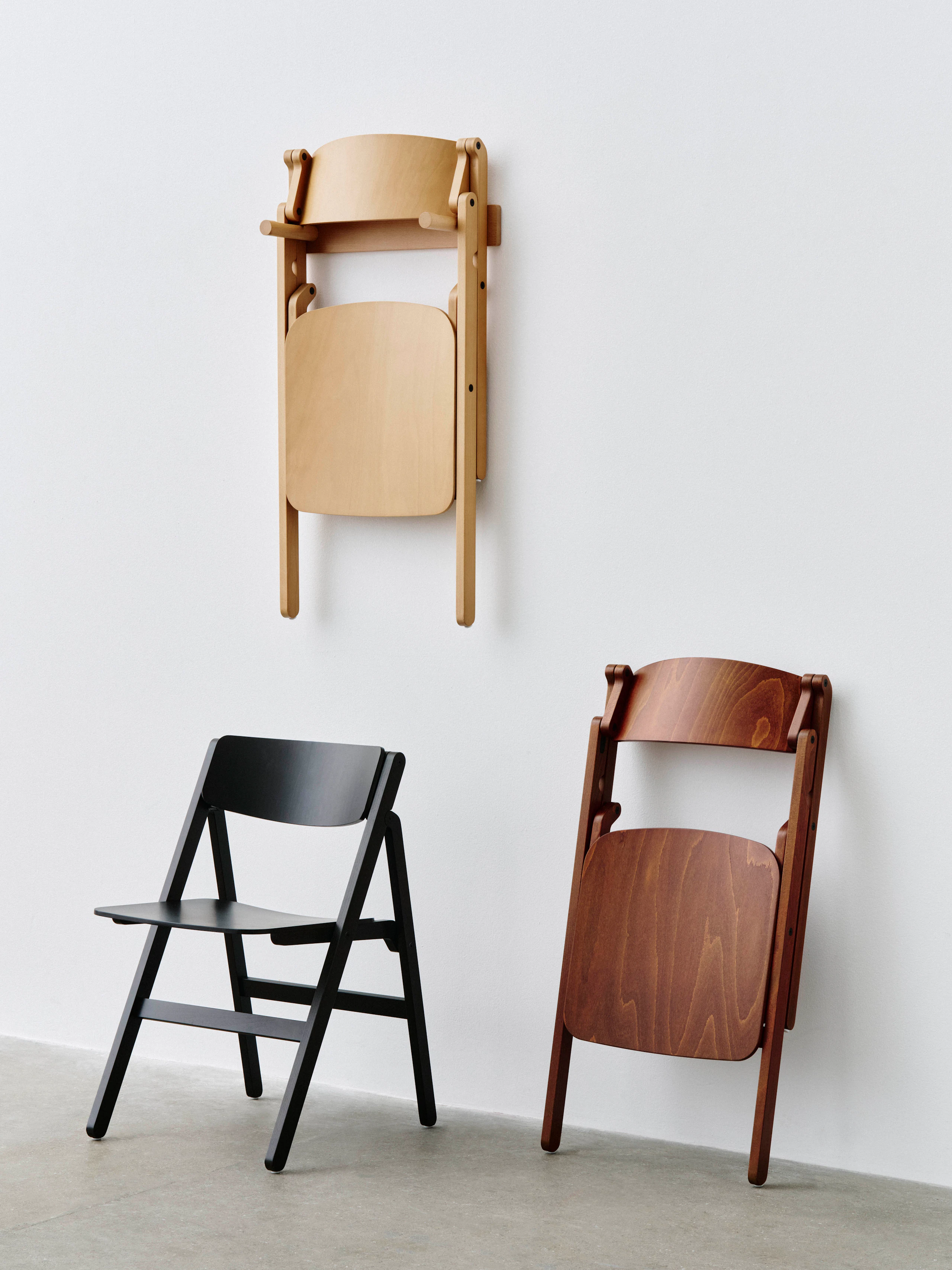 Backflip chair hung on wall, closed against wall, and open