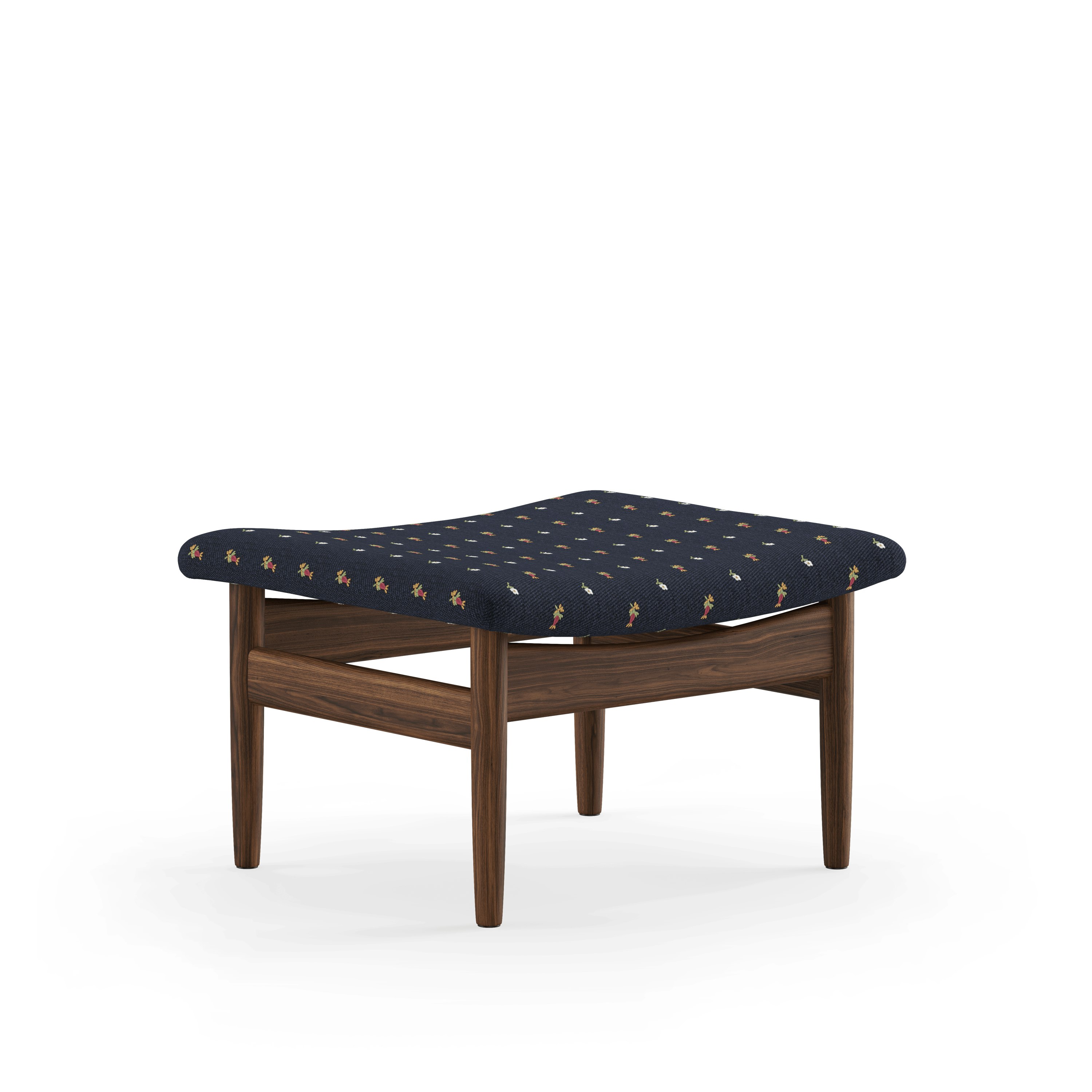 A Japan Footstool in Walnut viewed from an angle.