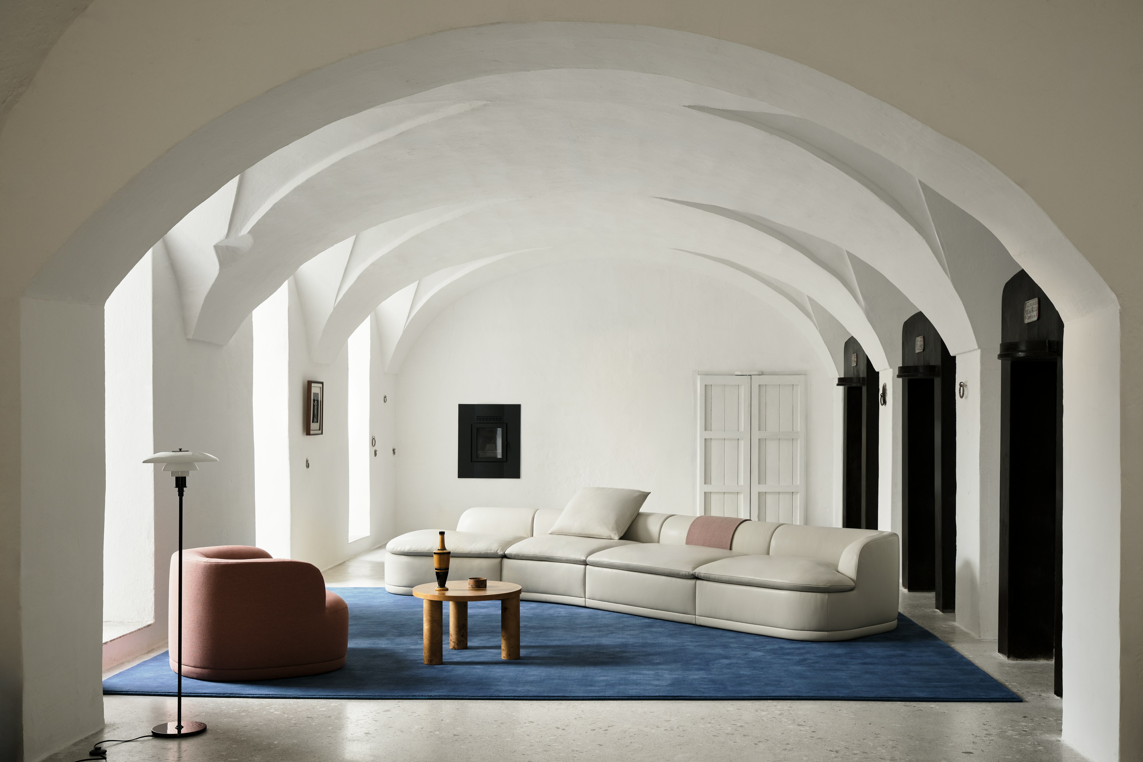 Atlason Composed Modular Sofa Open Sweep Sectional in leather viewed in a living room