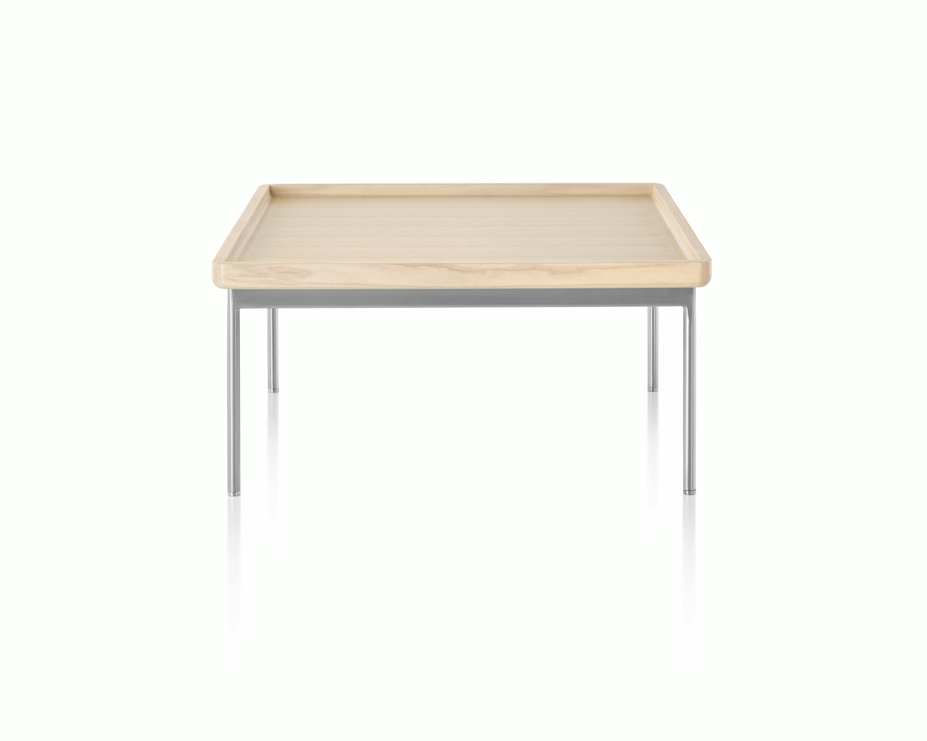 A rectangular Tuxedo Table with a light woodgrain finish and silver metal base, viewed from the long side.