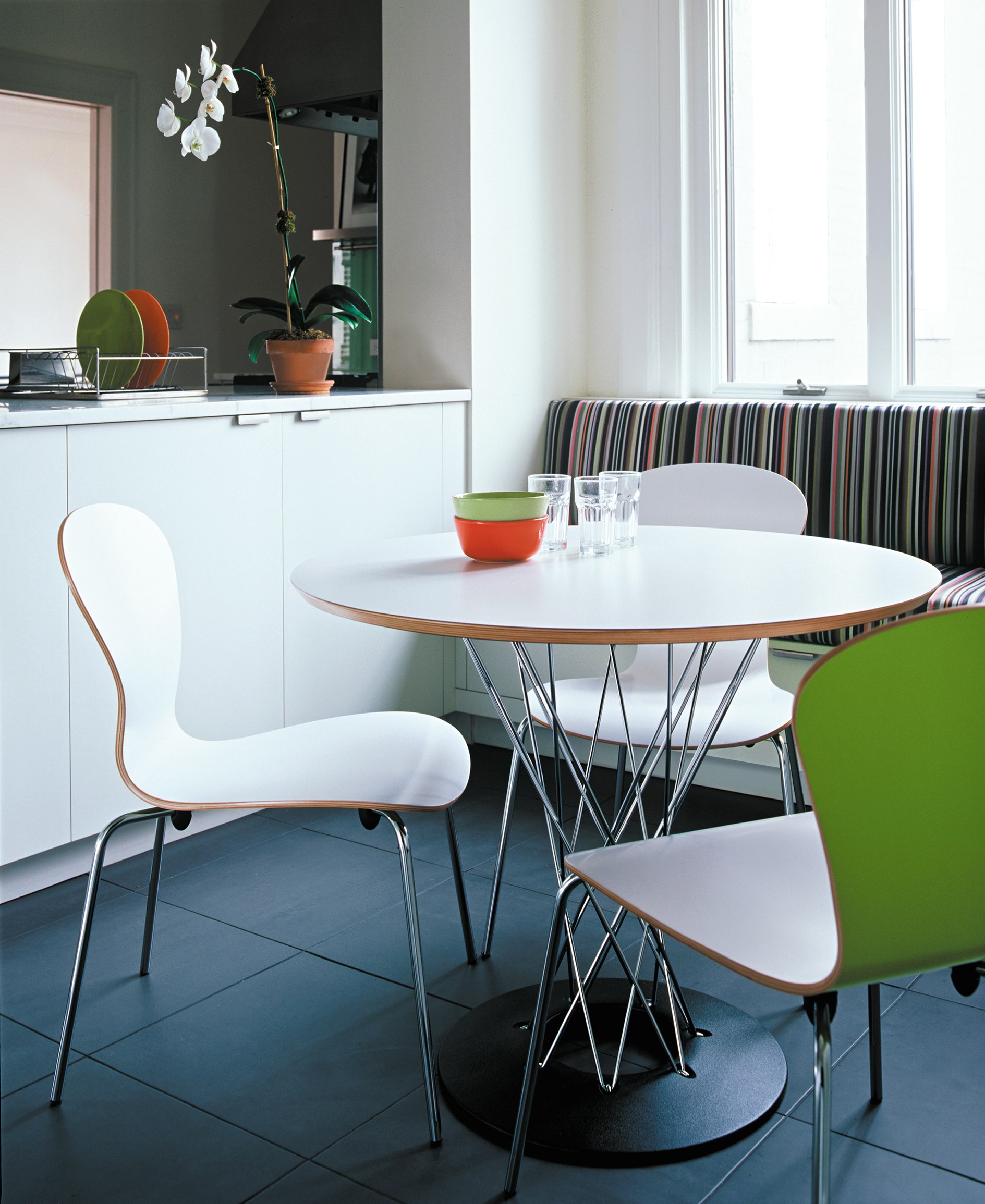 Cyclone Dining Table by Isamu Noguchi and white Sprite chair by Ross Lovegrove