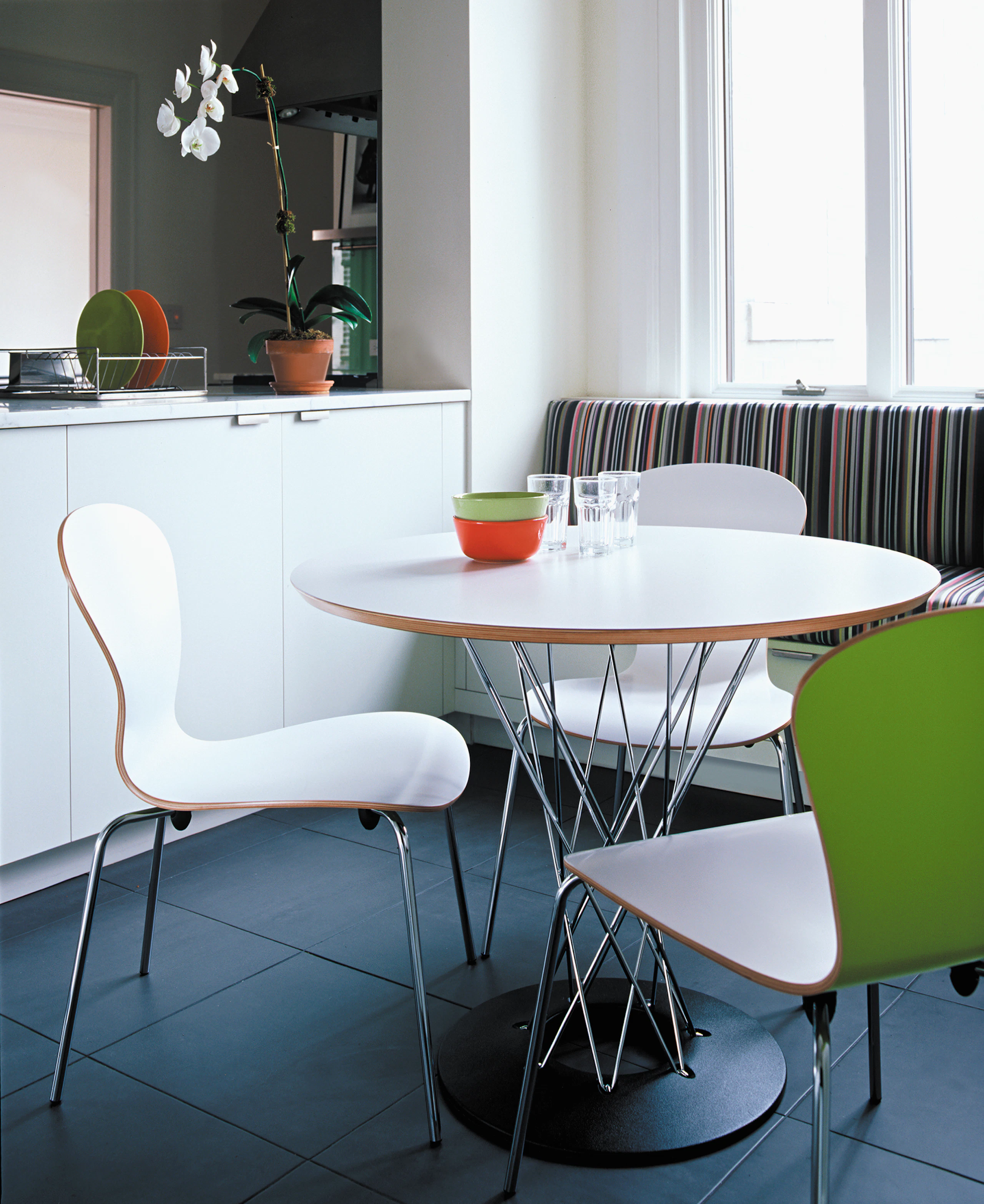 Cyclone Dining Table by Isamu Noguchi and white Sprite chair by Ross Lovegrove