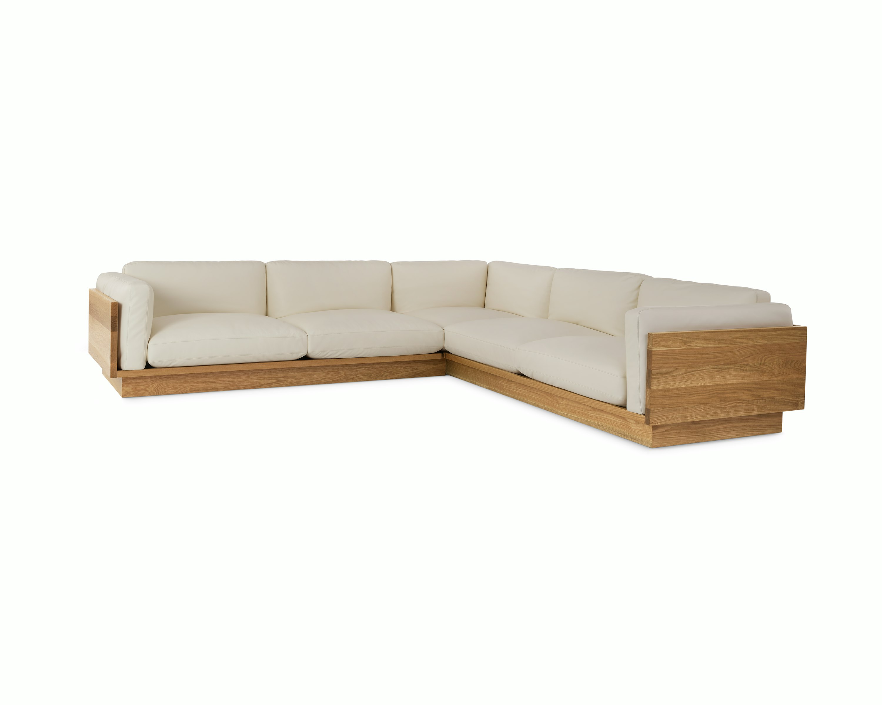 Pawson Drift Sectional Sofa with white leather upholstery and white oak base.