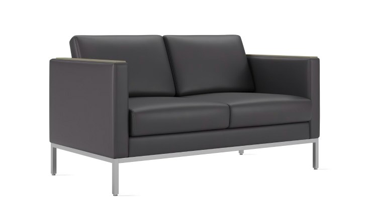 Angled view of a Riva Lounge Two Seat Sofa in grey black upholstery.