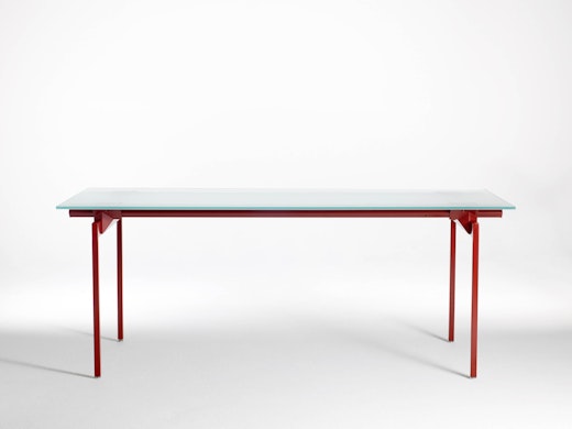 Antenna Workspaces Desk with glass top and red legs