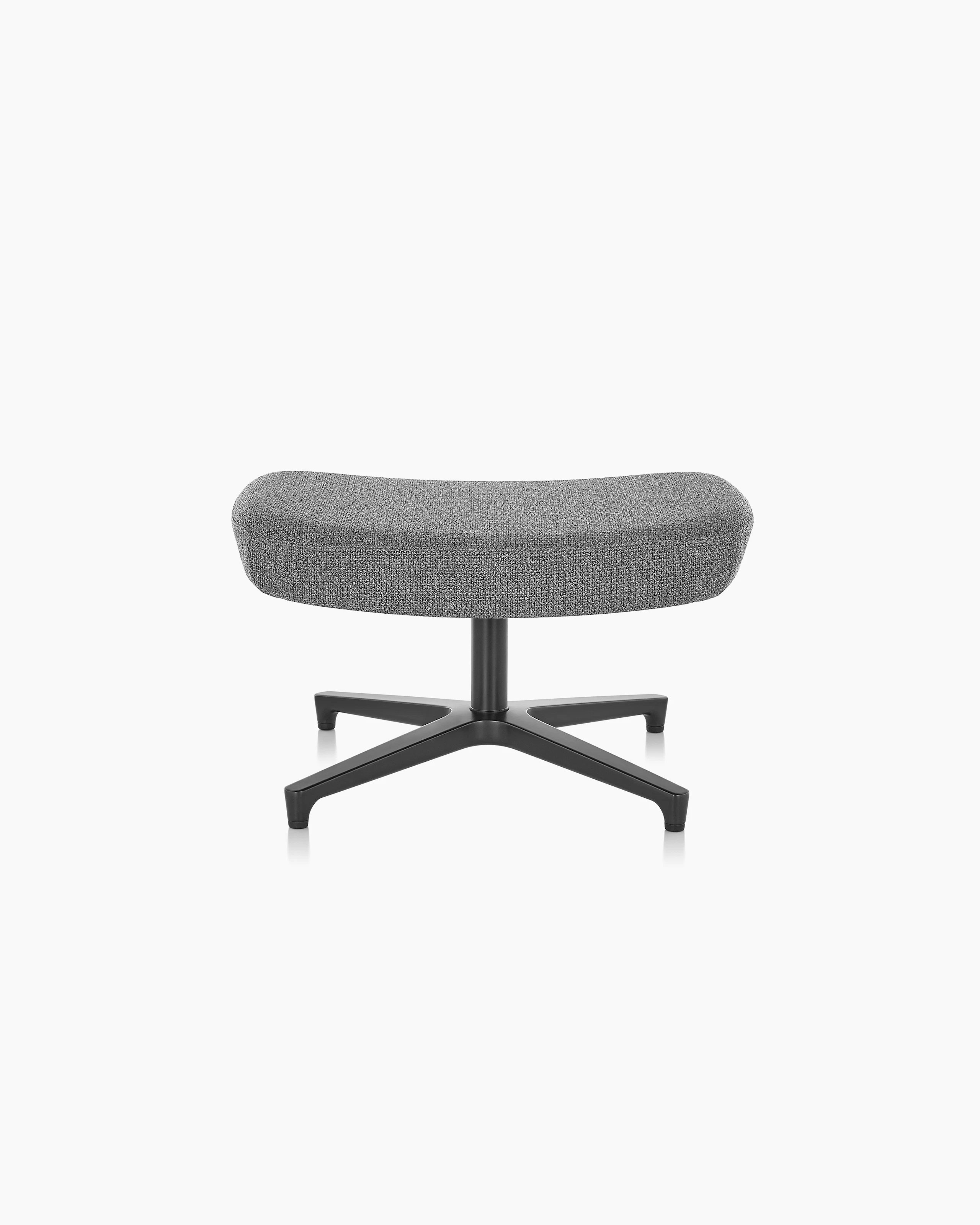 A rectangular Saiba ottoman with gray upholstery and a four-star base.