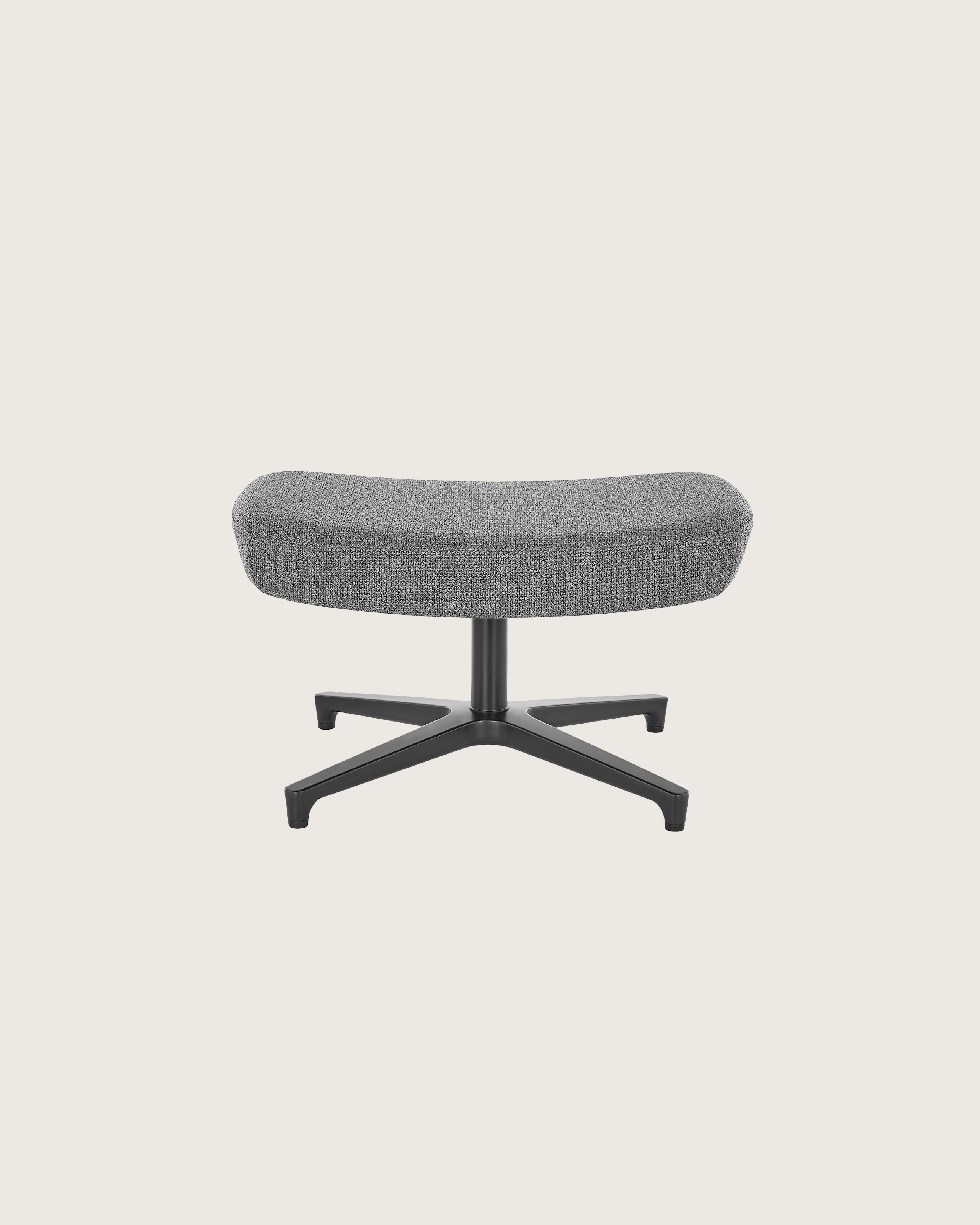A rectangular Saiba ottoman with gray upholstery and a four-star base.