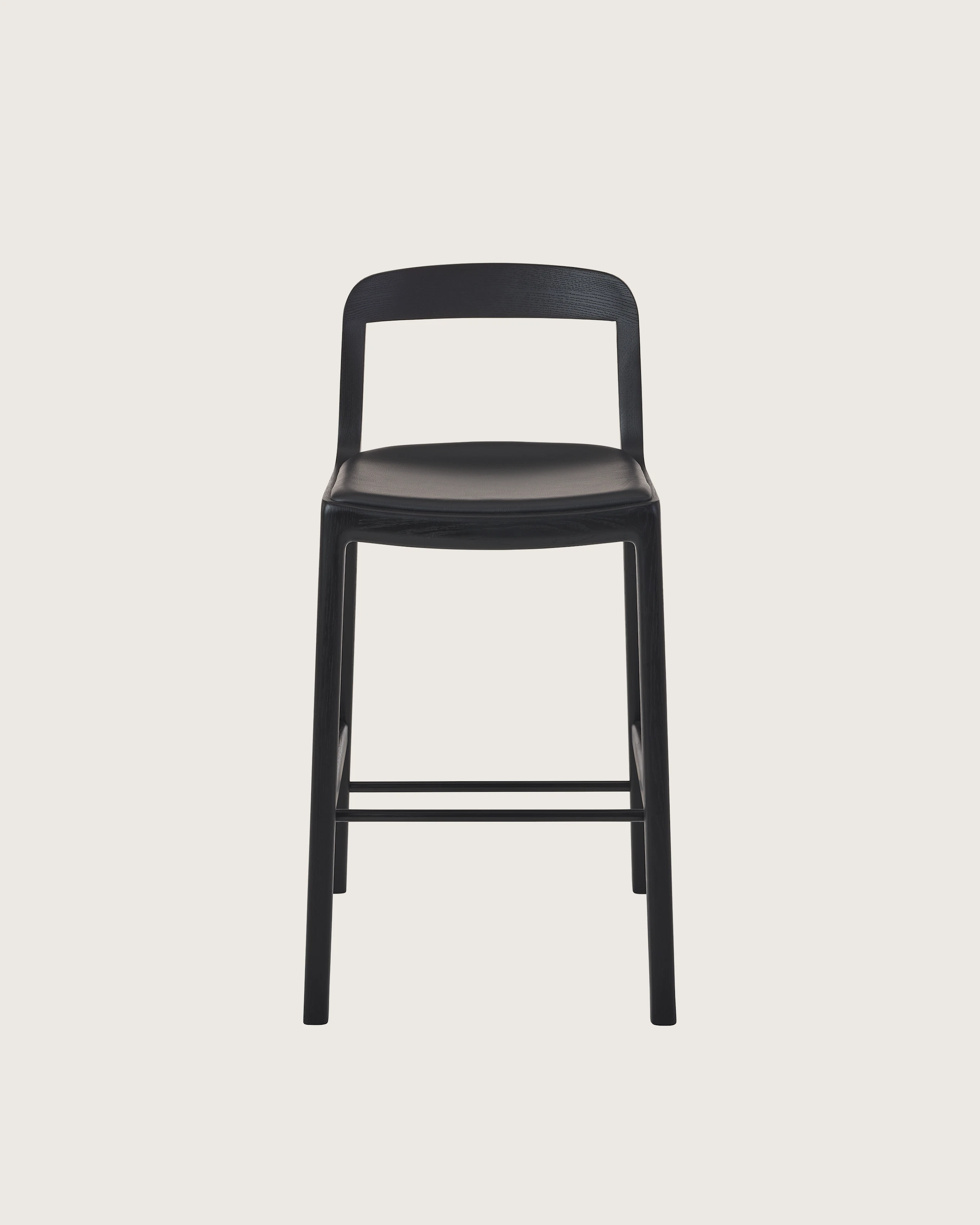 Lijn Stool by Carole Baijings for Geiger in Ebonized Oak frame upholstered with Maharam Prone Leather in Obsidian, front view on a white sweep.