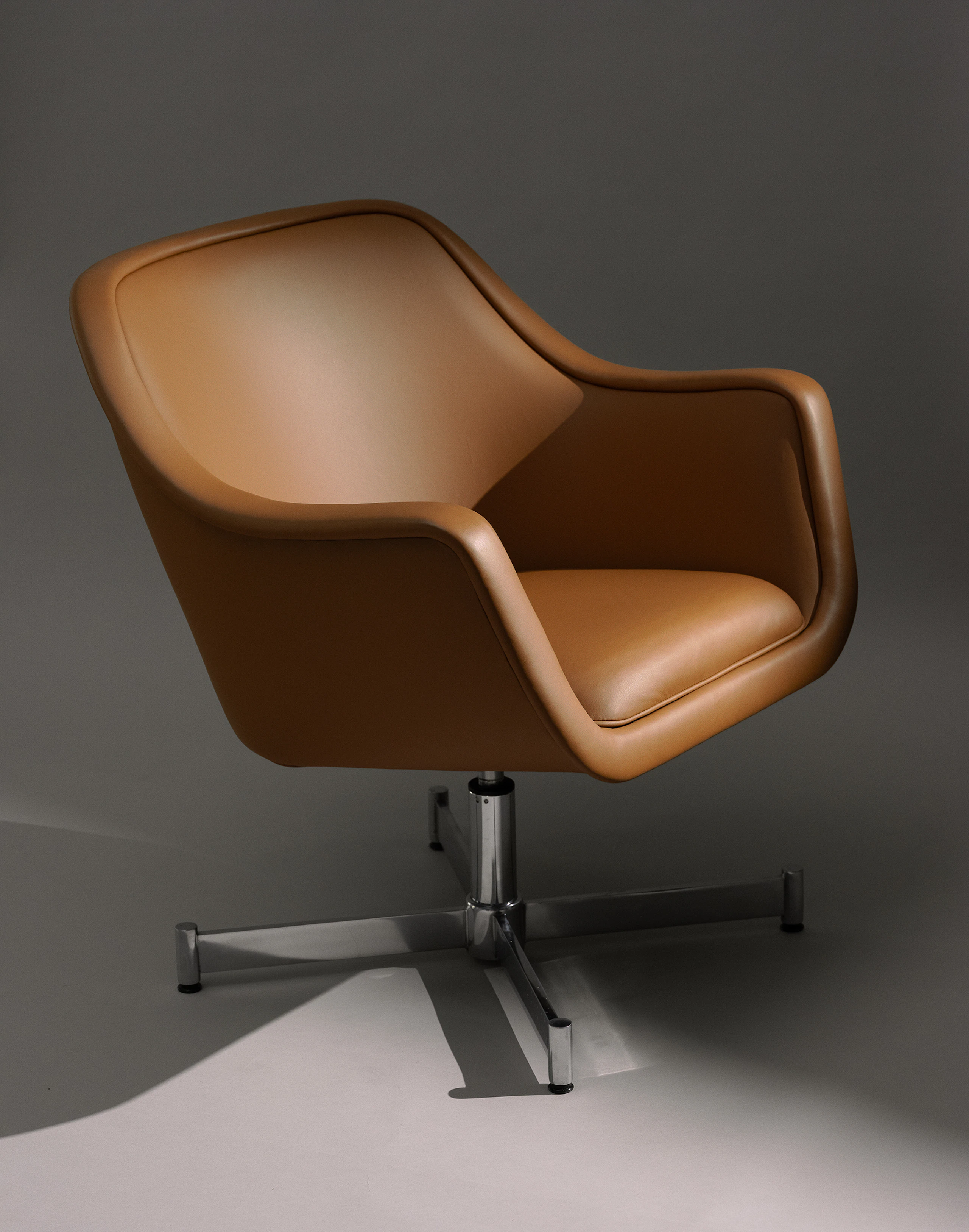 Bumper Lounge Chair designed by Ward Bennet, upholstered with Pace Leather in Toffee, viewed at an angle.