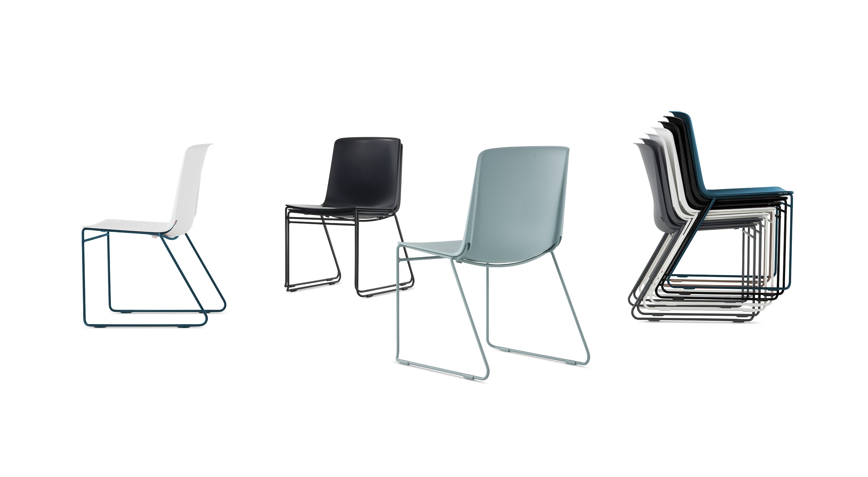 A group of multi colored Pronta Stacking Chairs.