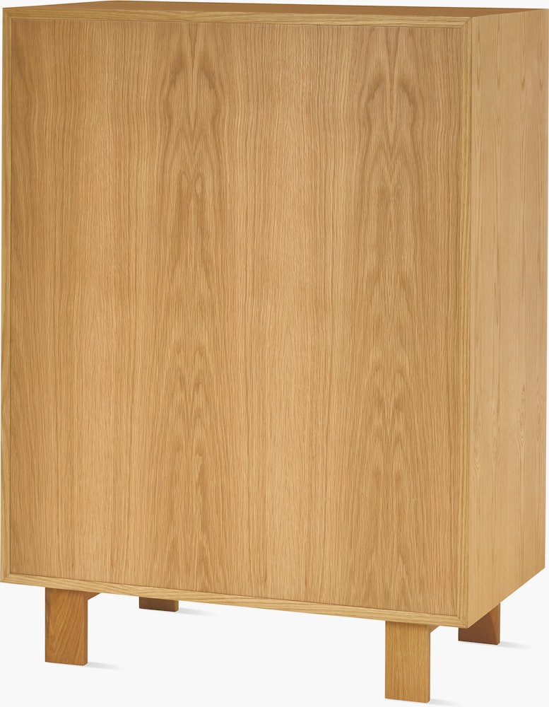 Nelson Basic Cabinet Series Console in natural oak, two doors, three drawers, standard square legs, wavy pulls.