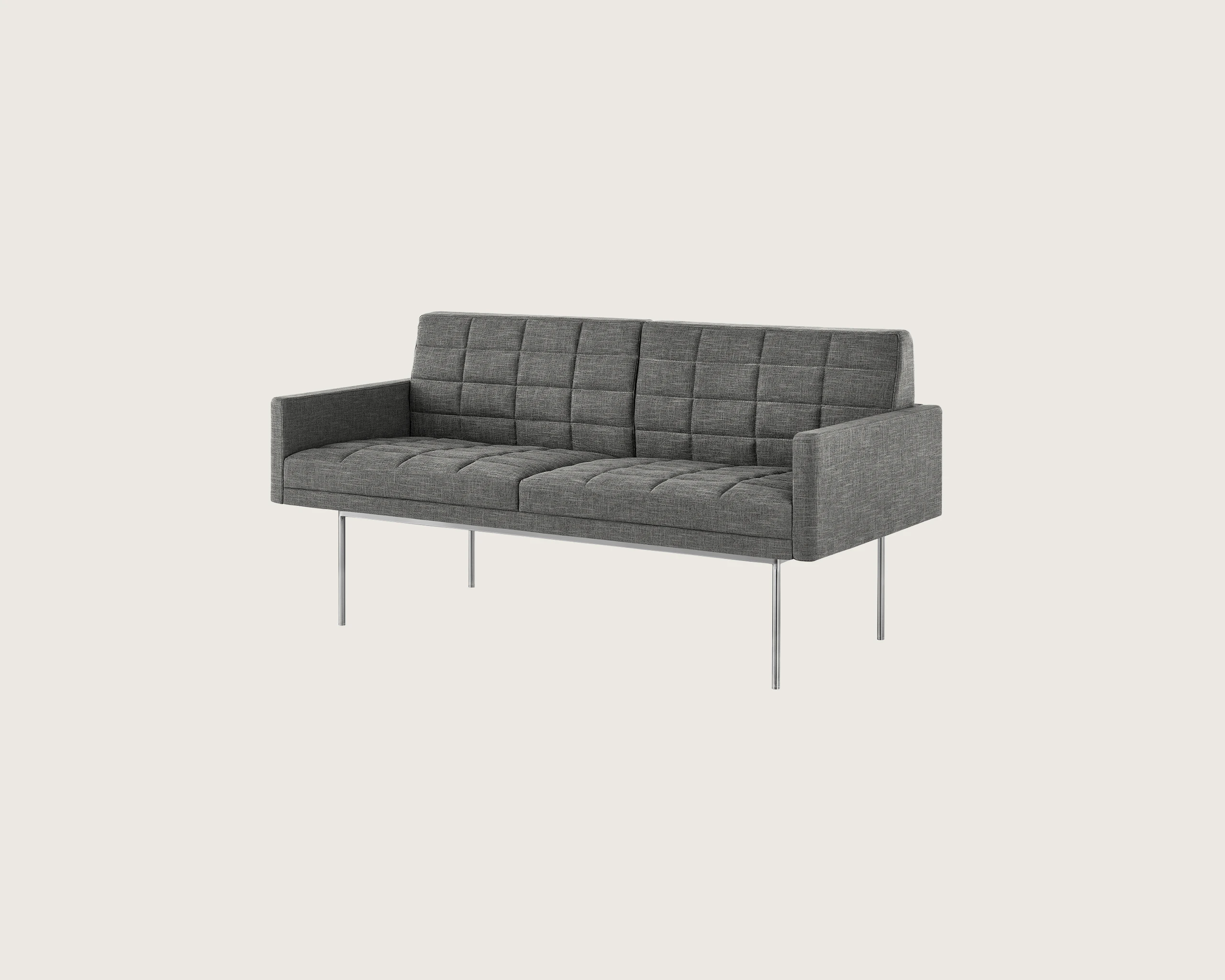 A quilted Tuxedo Settee with arms, upholstered in a light grey fabric with a metal base, viewed at an angle.