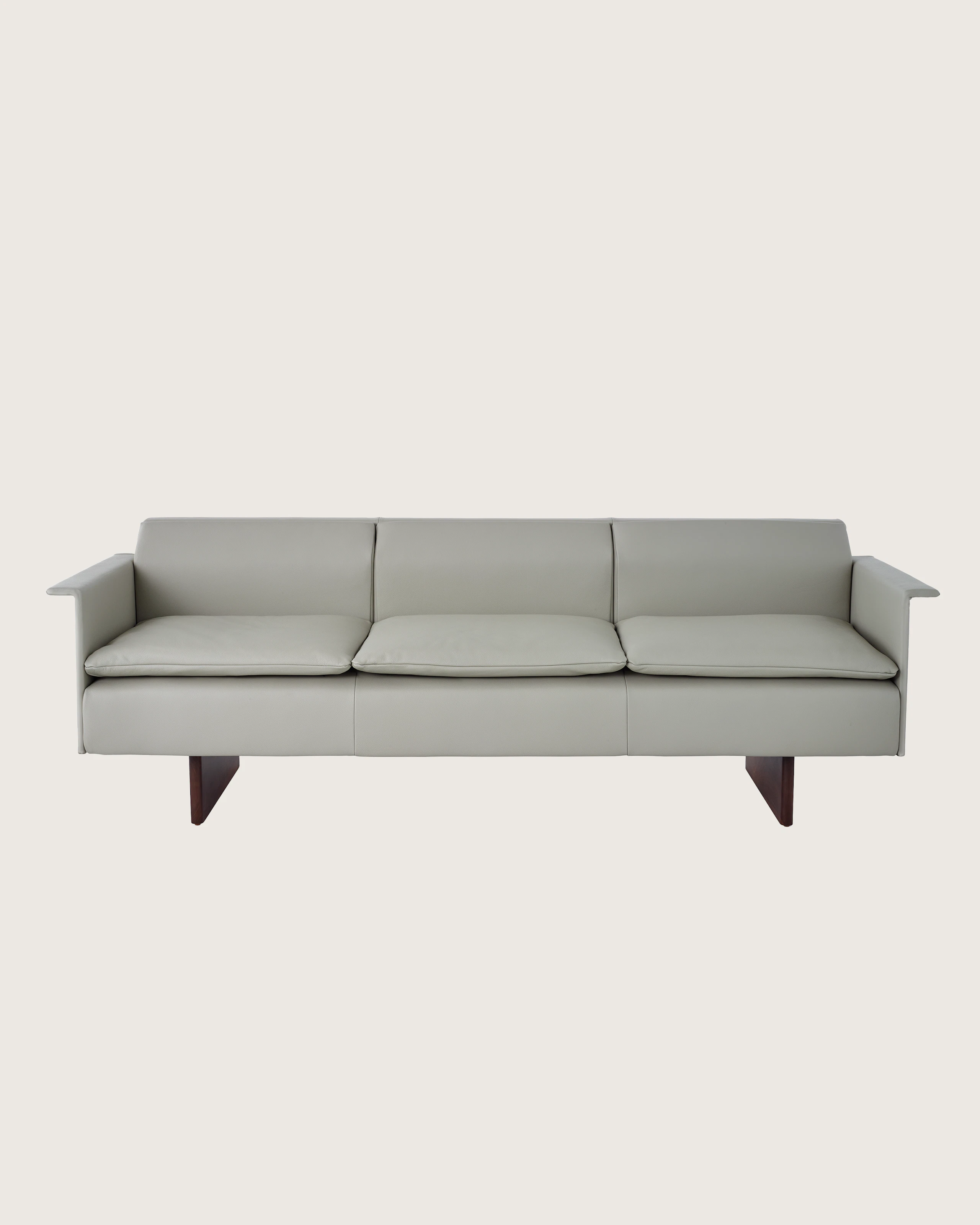 Mantle Three Seater Sofa with Walnut Wood Base in Bristol Leather Ash Gray.