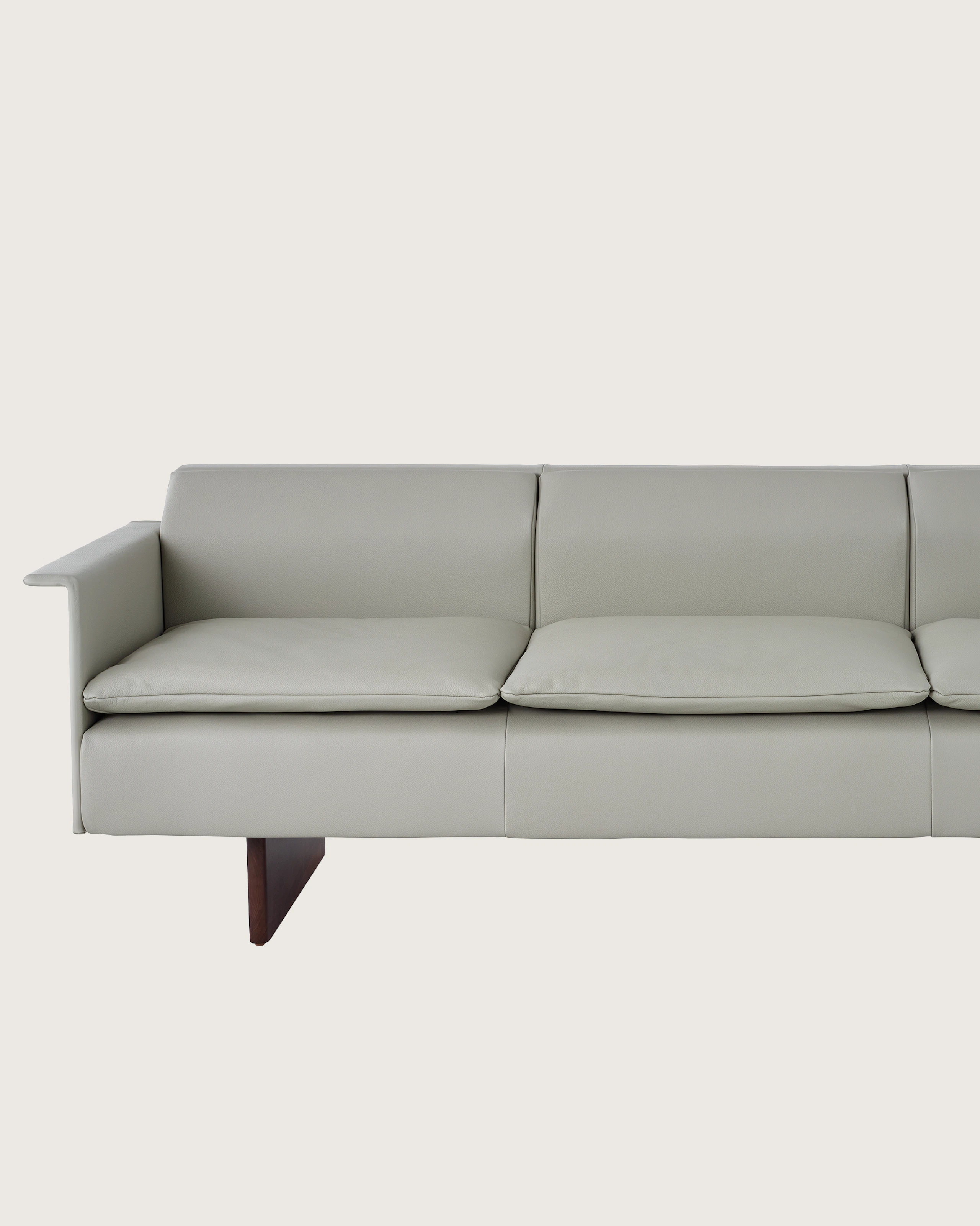 Mantle Three Seater Sofa with Walnut Wood Base in Bristol Leather Ash Gray.
