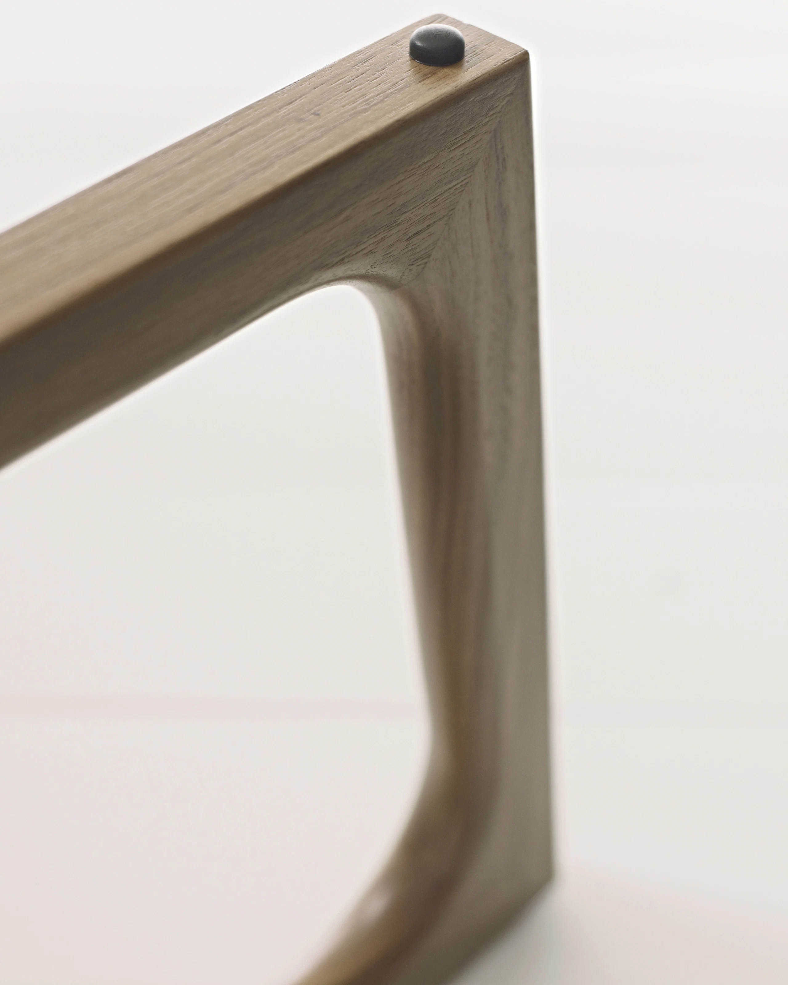 Close-up of walnut Loophole Table base.