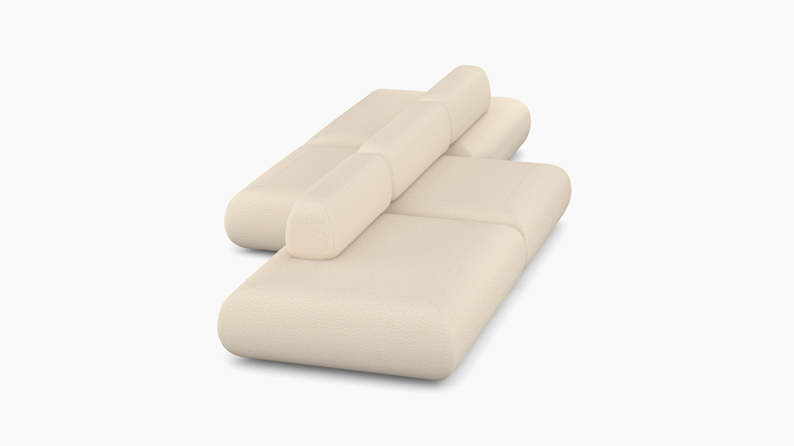 A Sval Staggered Sofa in Cream viewed from the side.