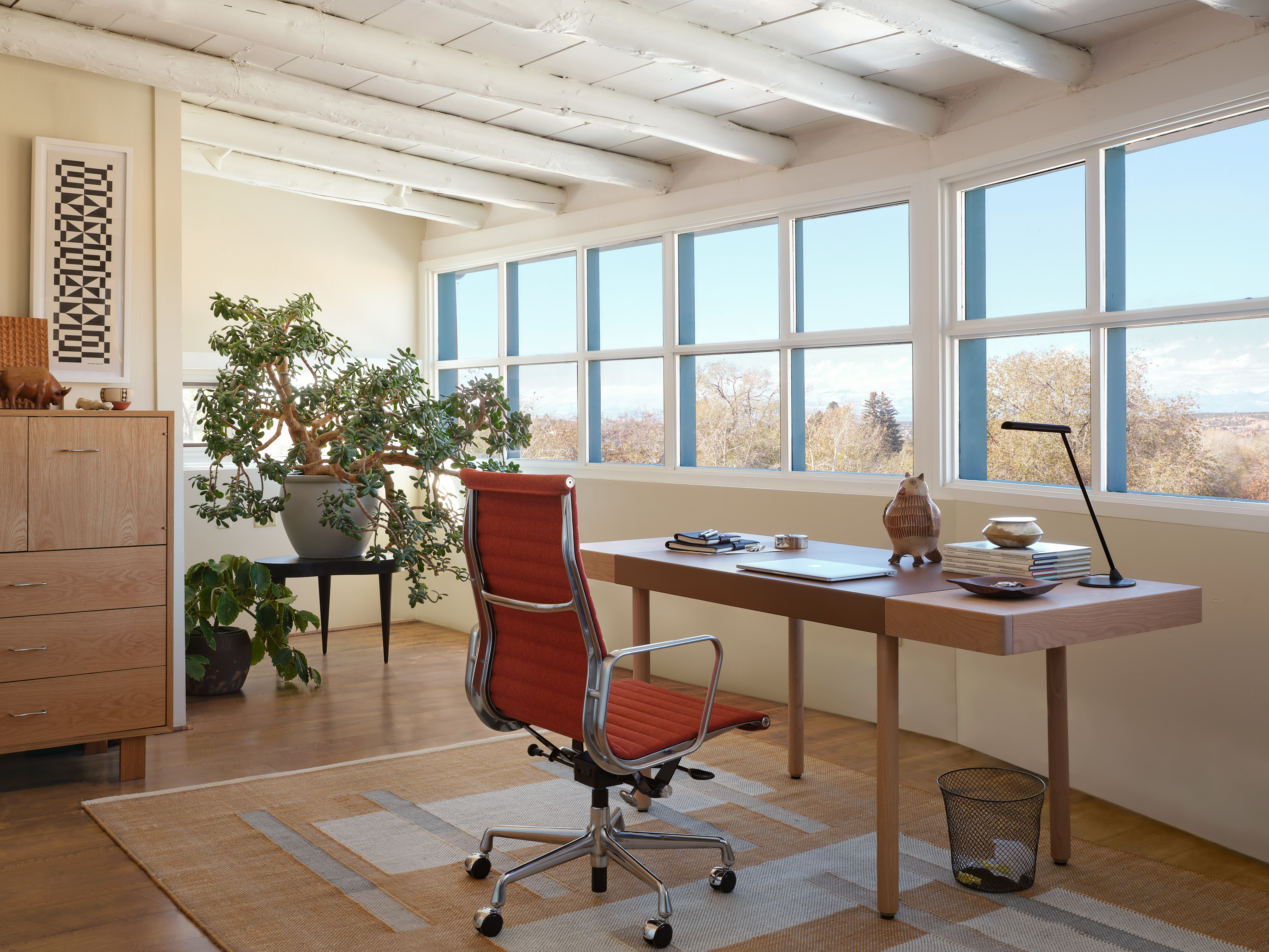 Leatherwrap Sit-to-Stand desk with Eames Aluminum Group Chair