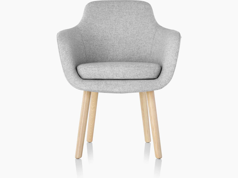 A Saiba Side Chair with light gray upholstery and wood legs in a light finish, viewed from the front.