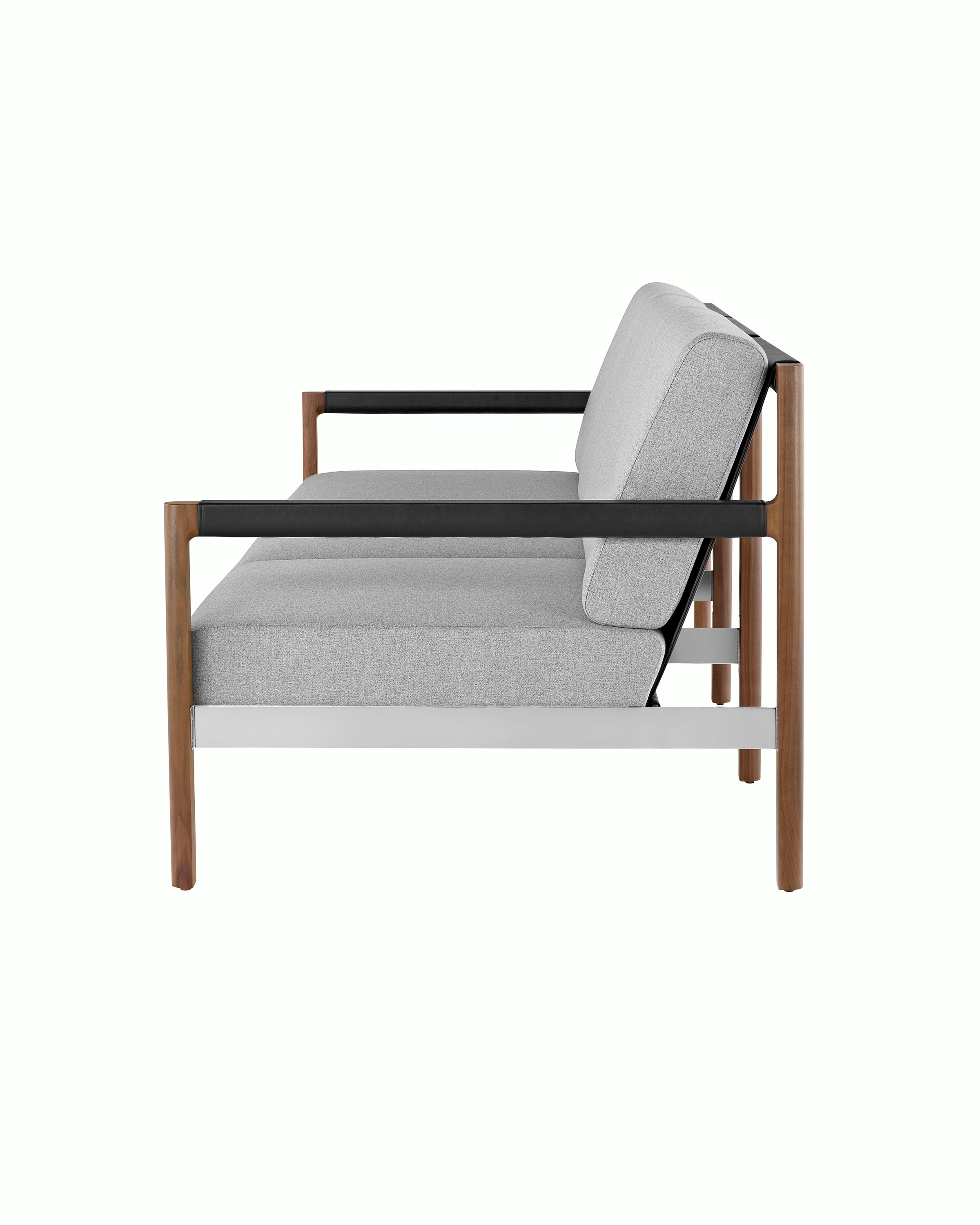 A Brabo Sofa with light gray upholstery, leather and metal accents, and an exposed wood frame. Viewed from the side.