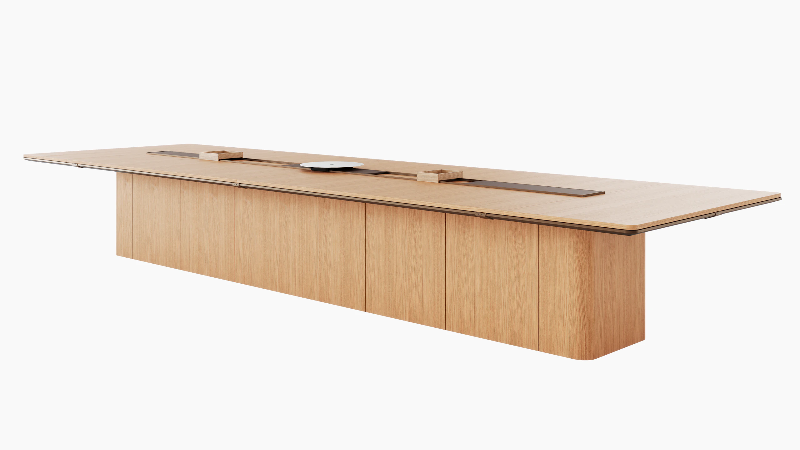 60"×204"Ascent Conference Table designed by EOOS in Natural Rift Cut Oak with a plinth base, central power trough, an AV platform, and accessory trays, viewed at an angle.
