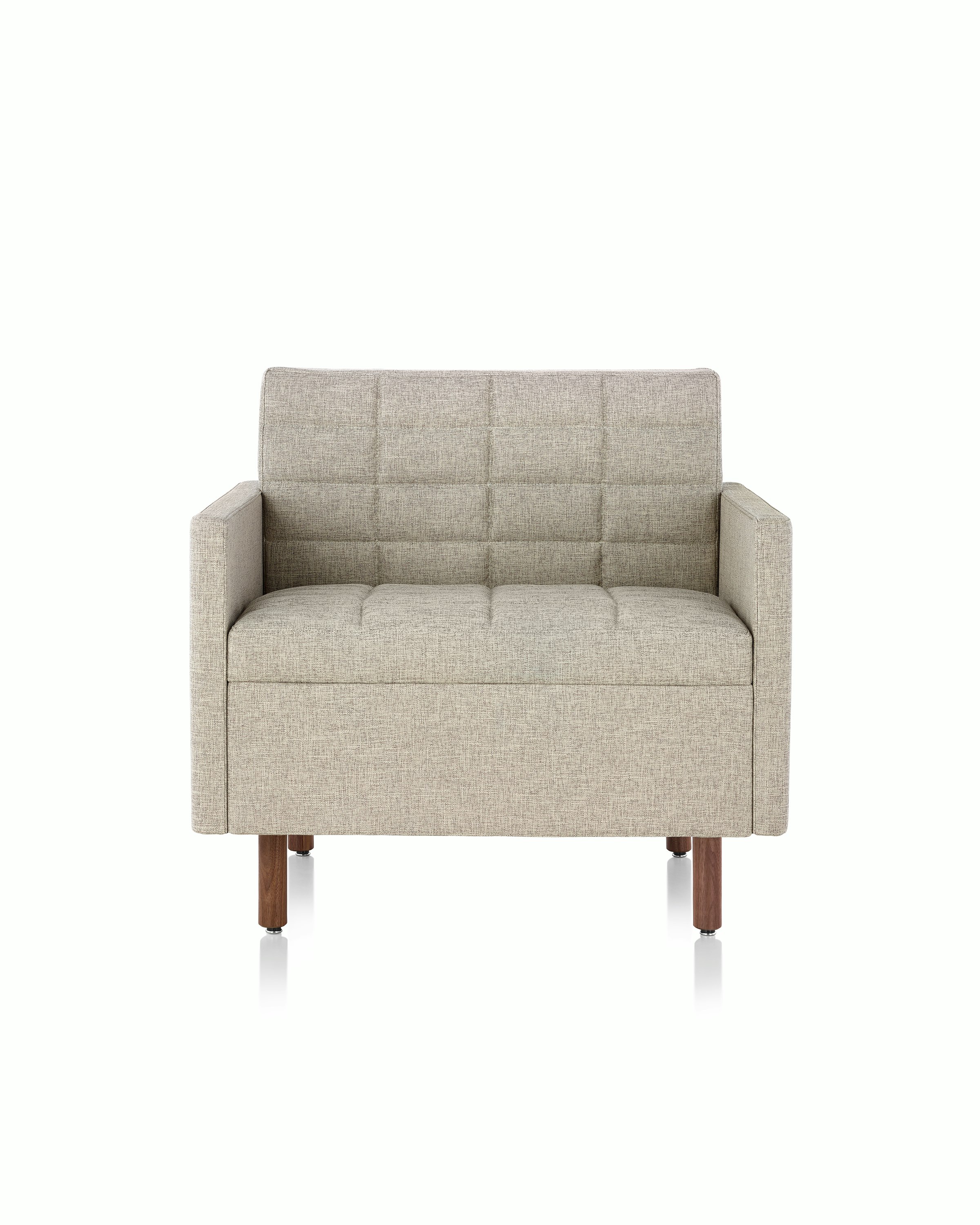 A Tuxedo Classic club chair with bone-colored quilted upholstery, viewed from the front.