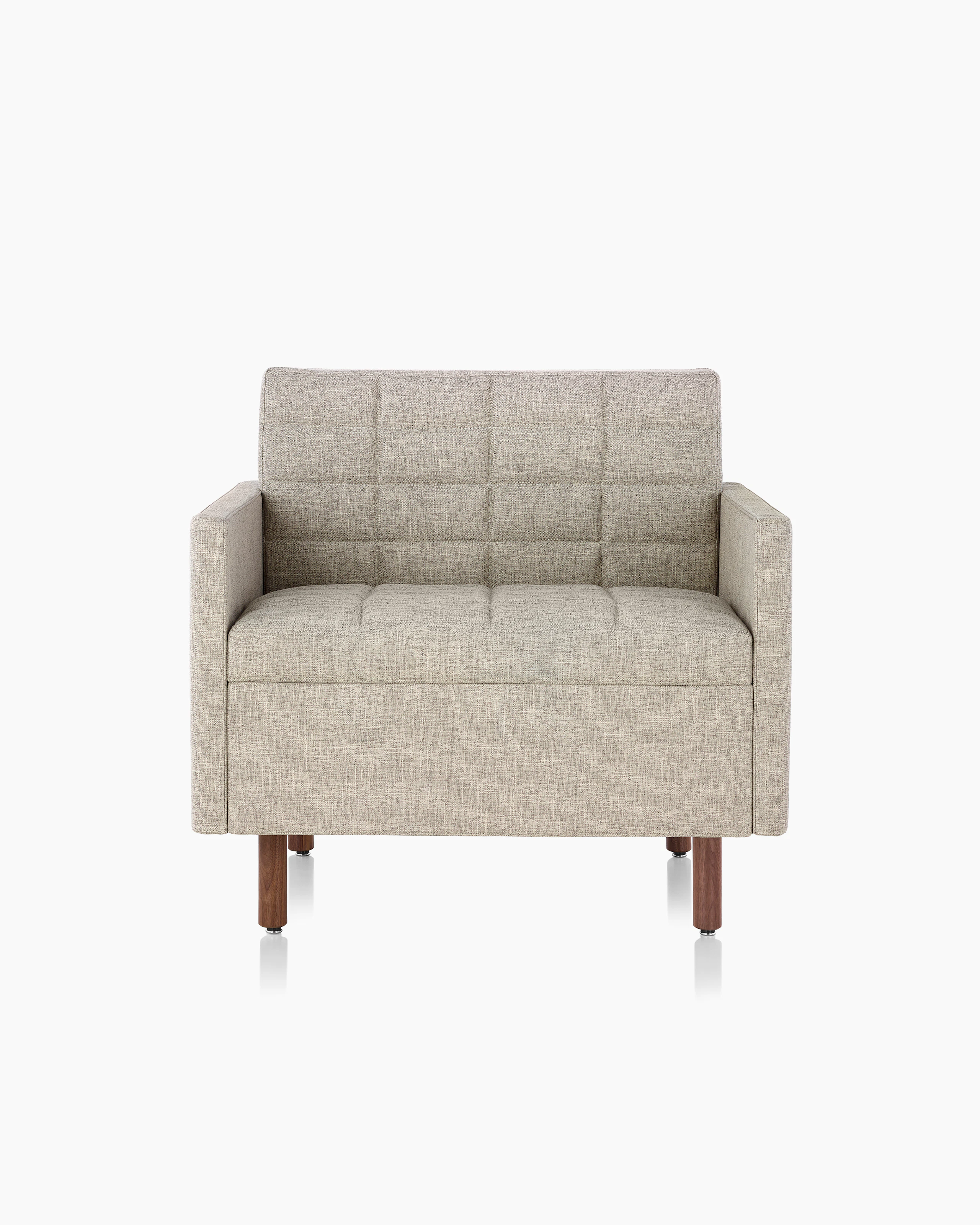 A Tuxedo Classic club chair with bone-colored quilted upholstery, viewed from the front.