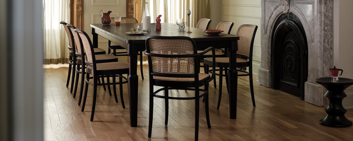 Danbury Dining Table in black oak with Hoffman Dining Chairs in a dining room setting