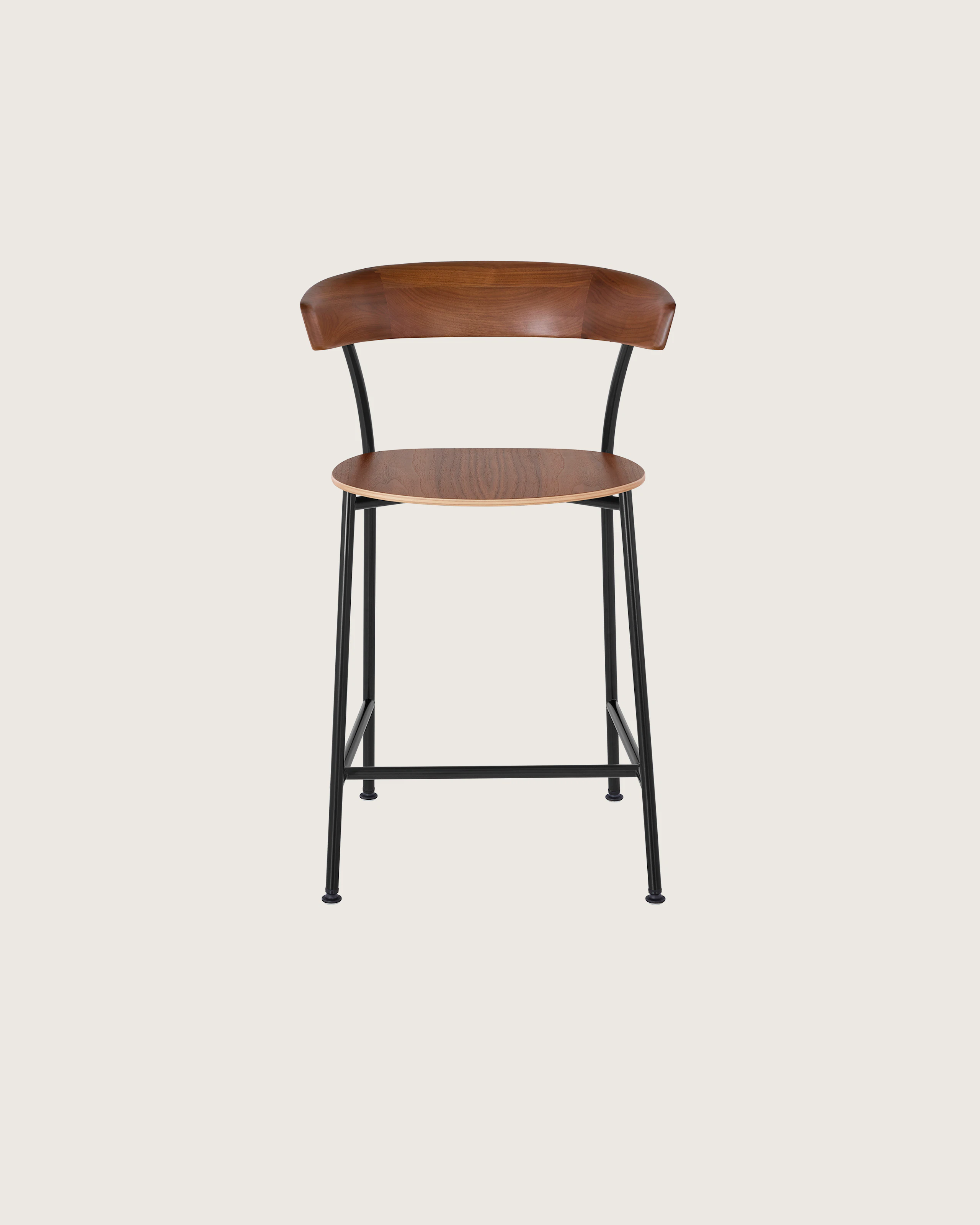 A Leeway Stool with a black metal frame and a wood backrest and seat in a medium finish, viewed from the front.
