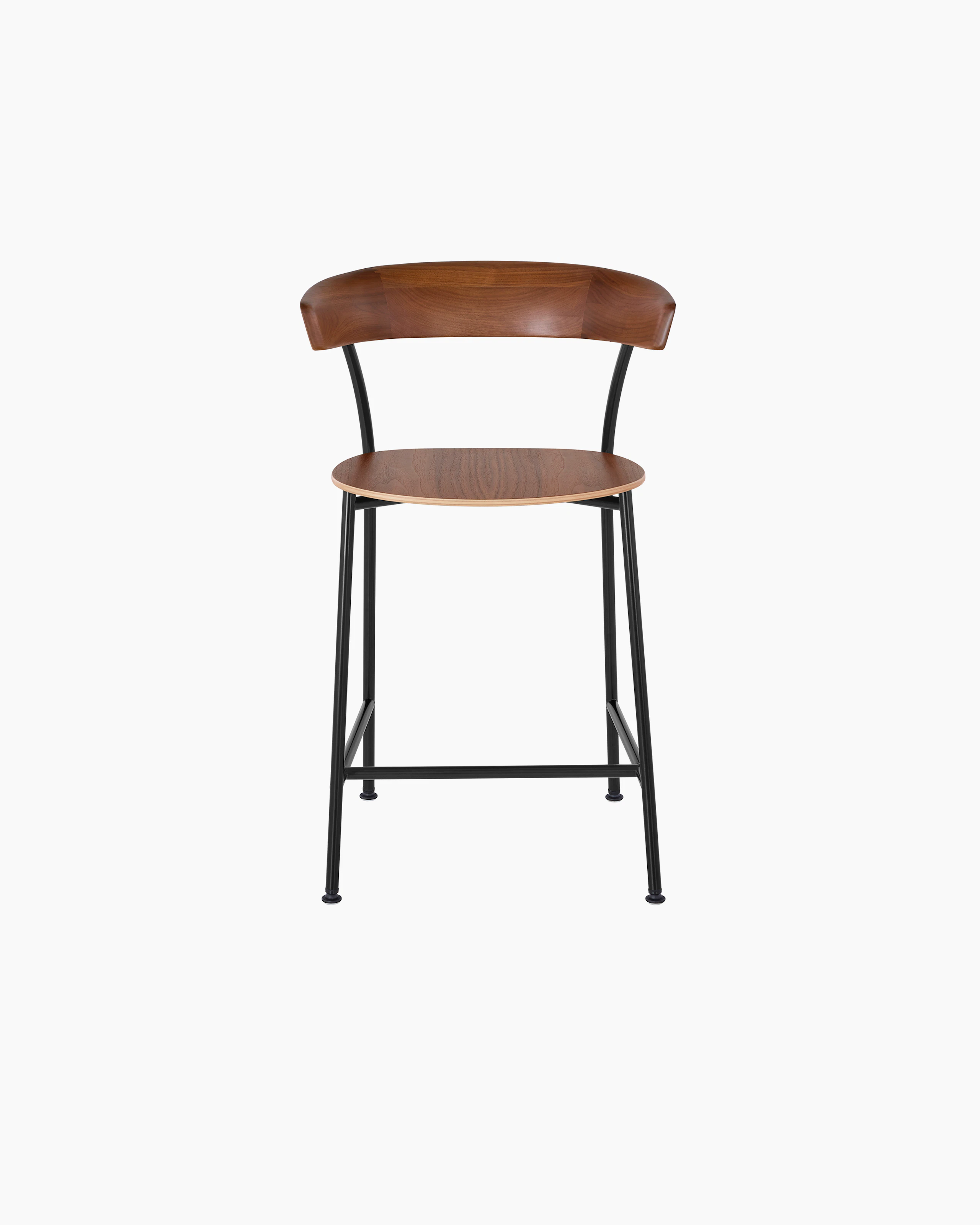 A Leeway Stool with a black metal frame and a wood backrest and seat in a medium finish, viewed from the front.