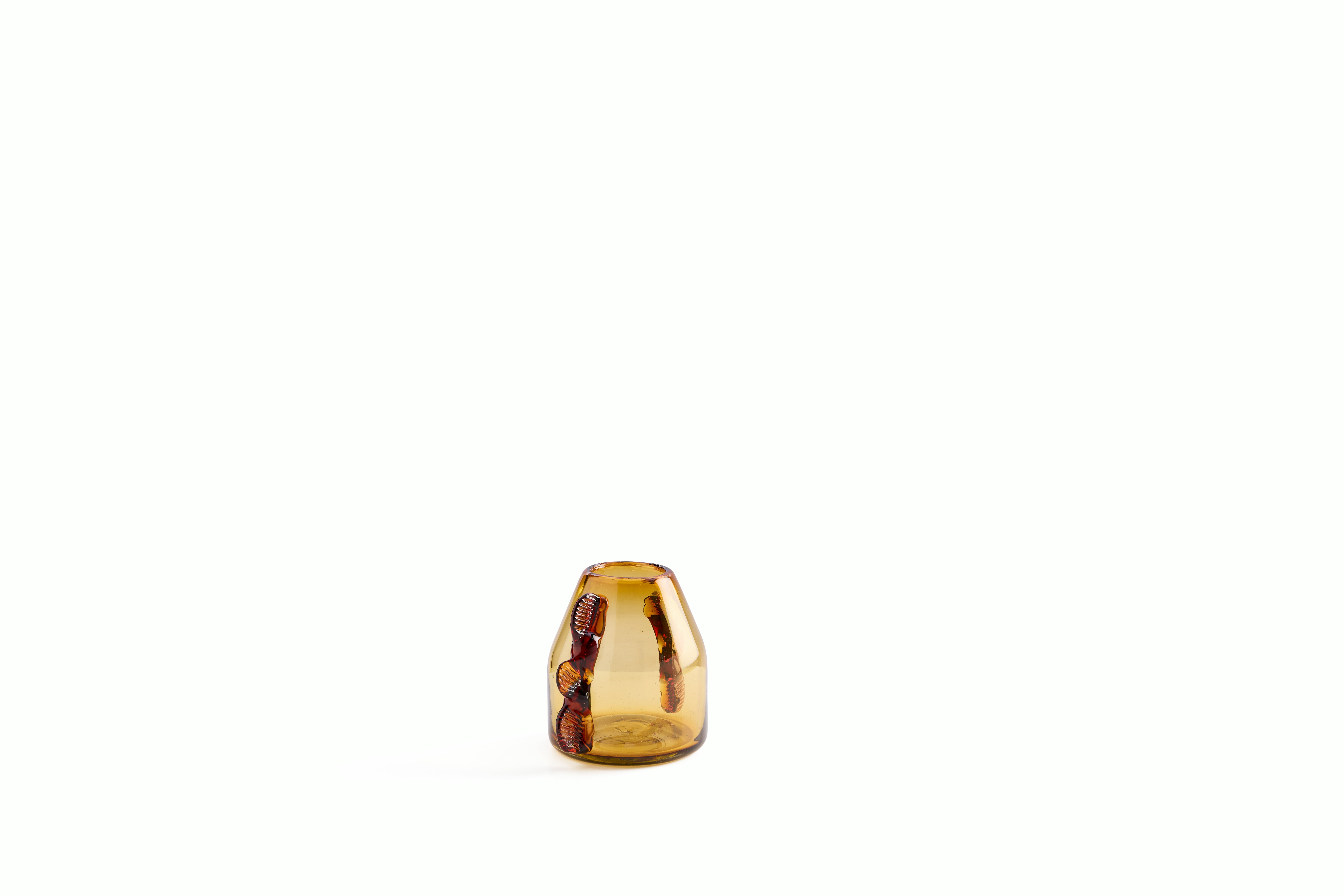 A Dalia Bud Vase in Amber viewed from an angle.