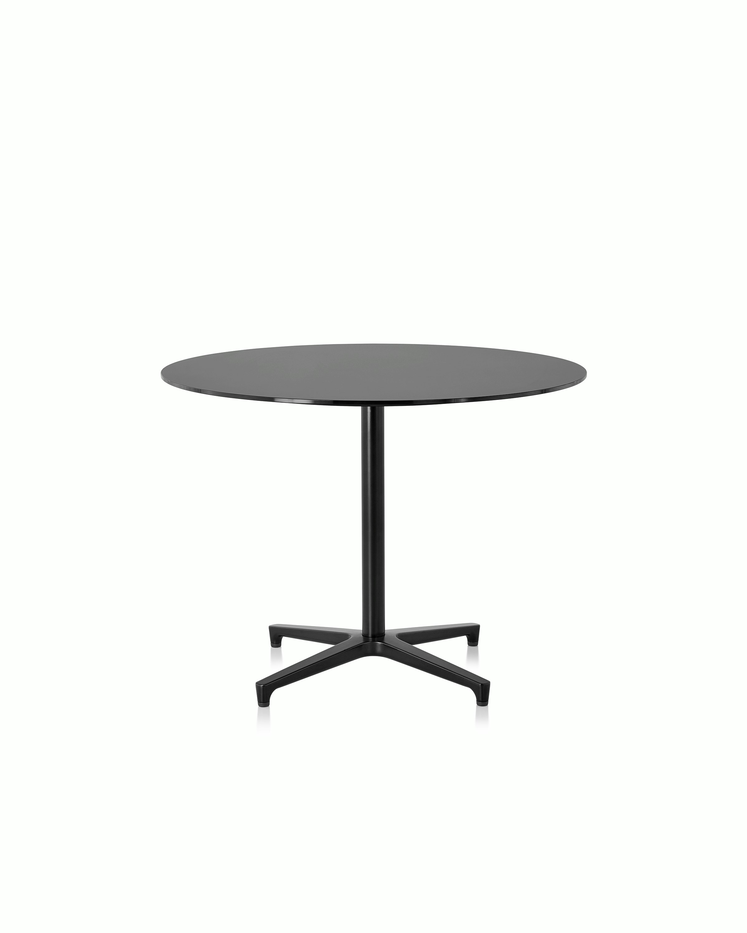 A round Saiba occasional table with a black laminate top and black base.