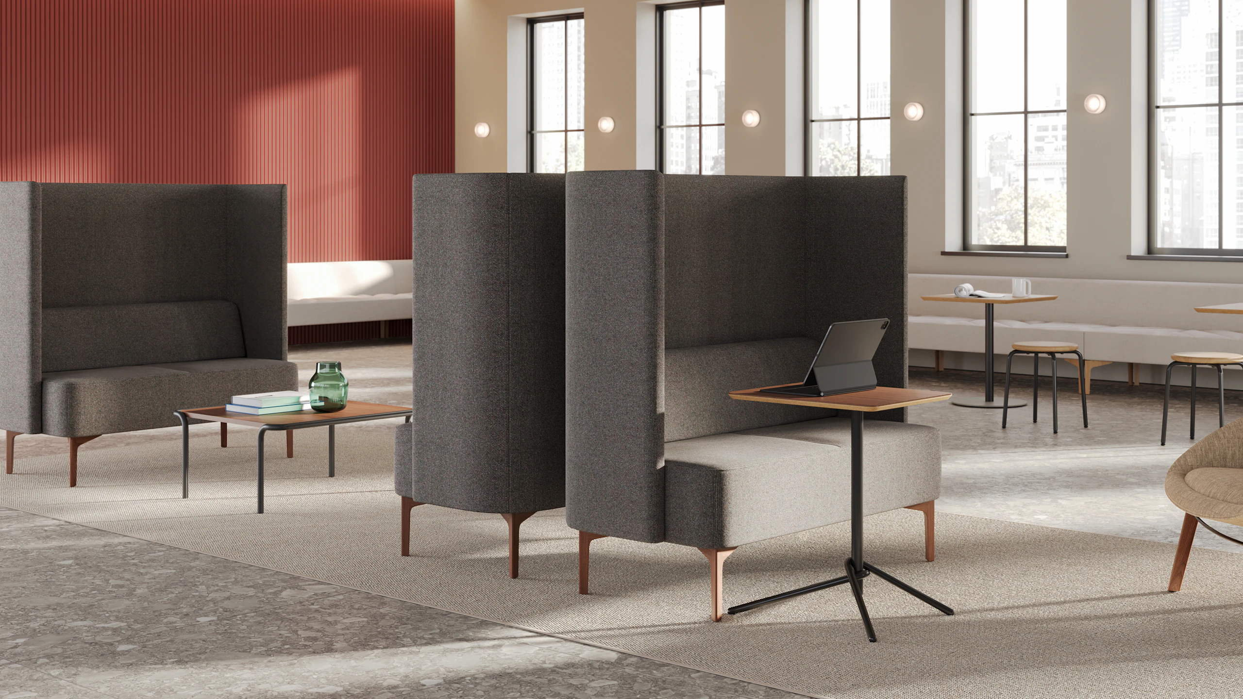Pullman 2-seat Sofas uphosltered in Maharam Tenebrous in an office setting with Knot Tables, Sweep Coffee Tables and Penny Stools, and an Always Lounge Chair.