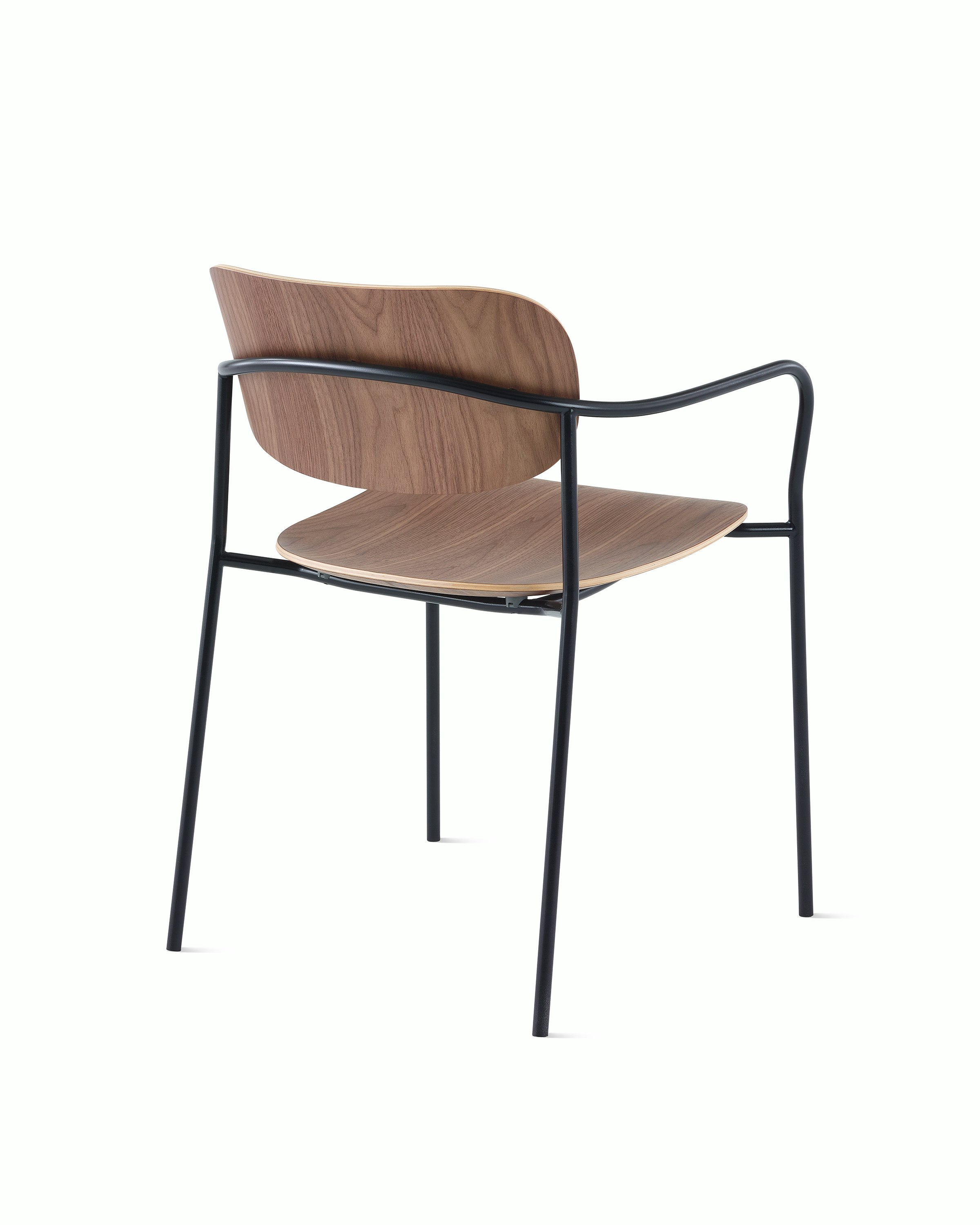Portrait Chair with Walnut seat and back, and black frame with arms.