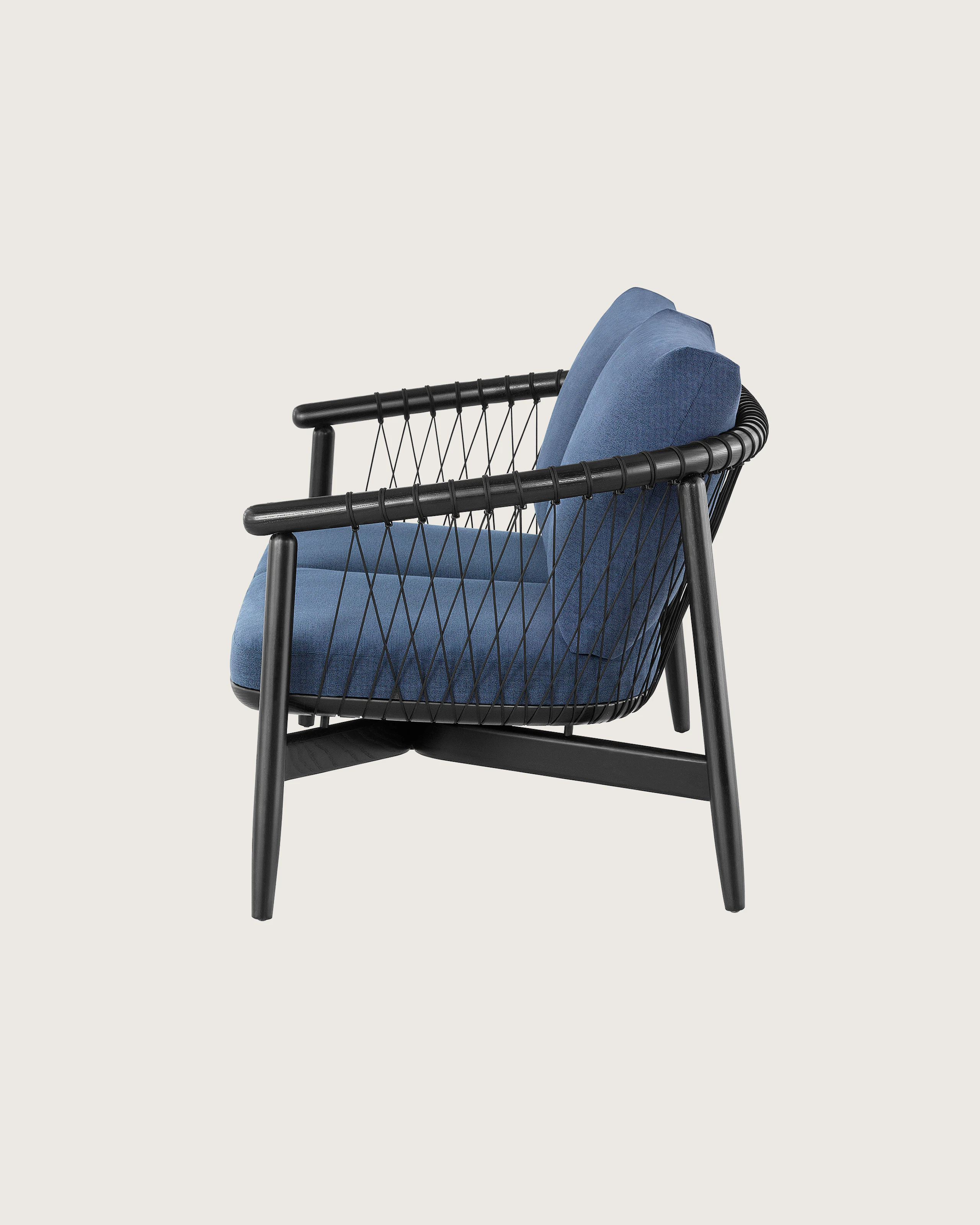 A dark colored Crosshatch Settee featuring navy upholstery and an ebony on ash frame. Viewed from the side.