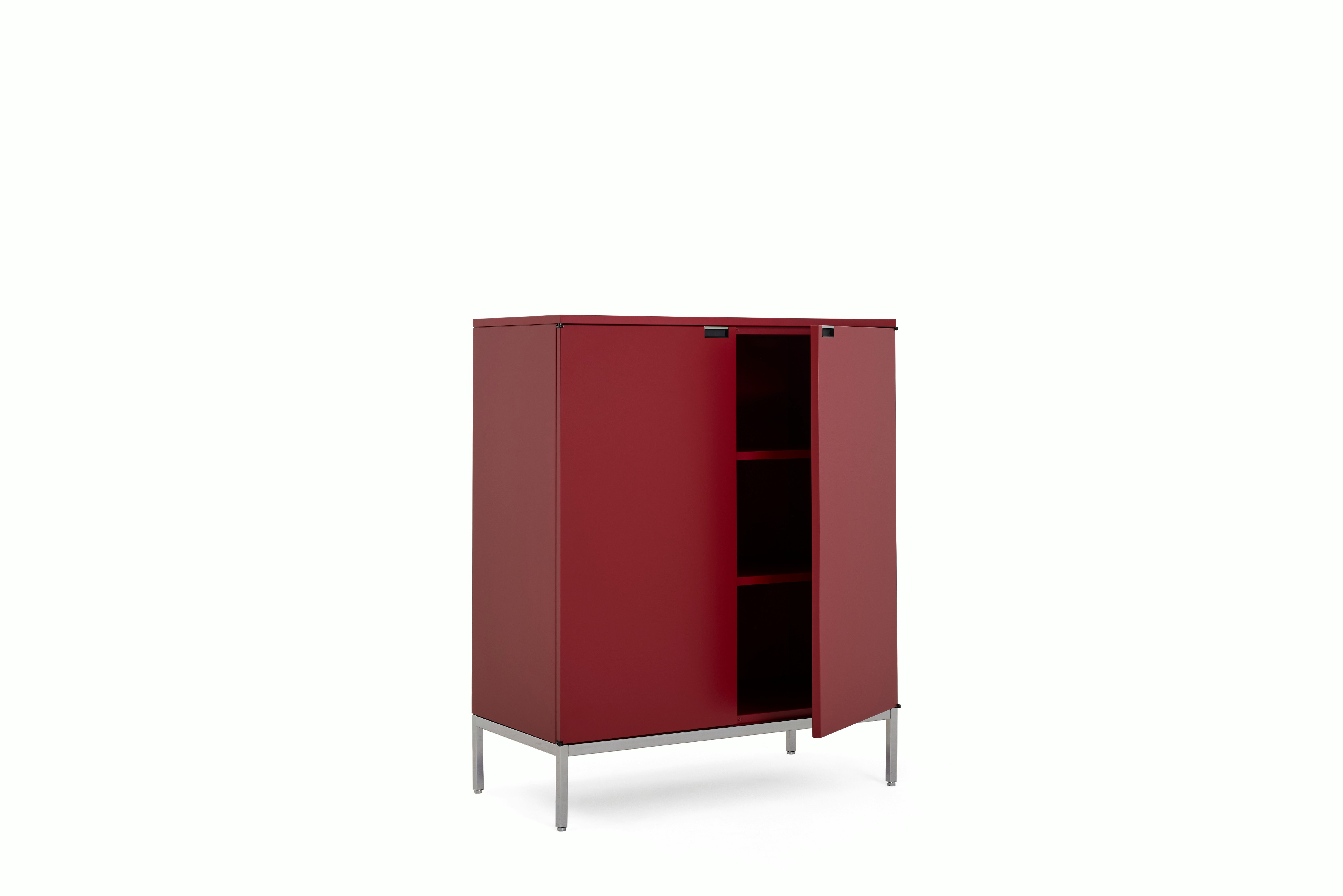 A Florence Knoll Credenza in Tall, Dark Red Lacquer, Lacquer, Dark Red Lacquer viewed from an angle.