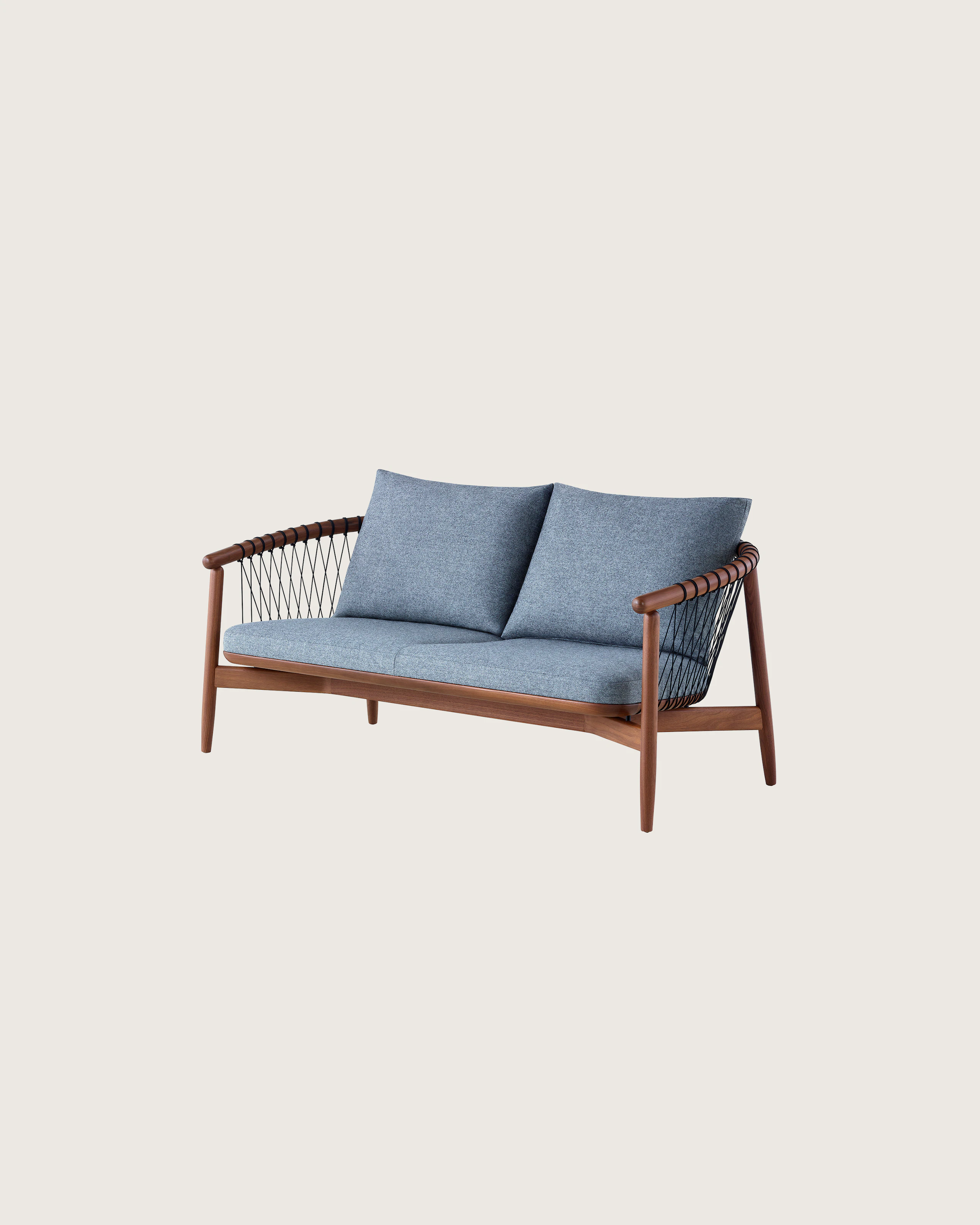 A dark colored Crosshatch Settee featuring gray upholstery and a walnut frame. Viewed at an angle.