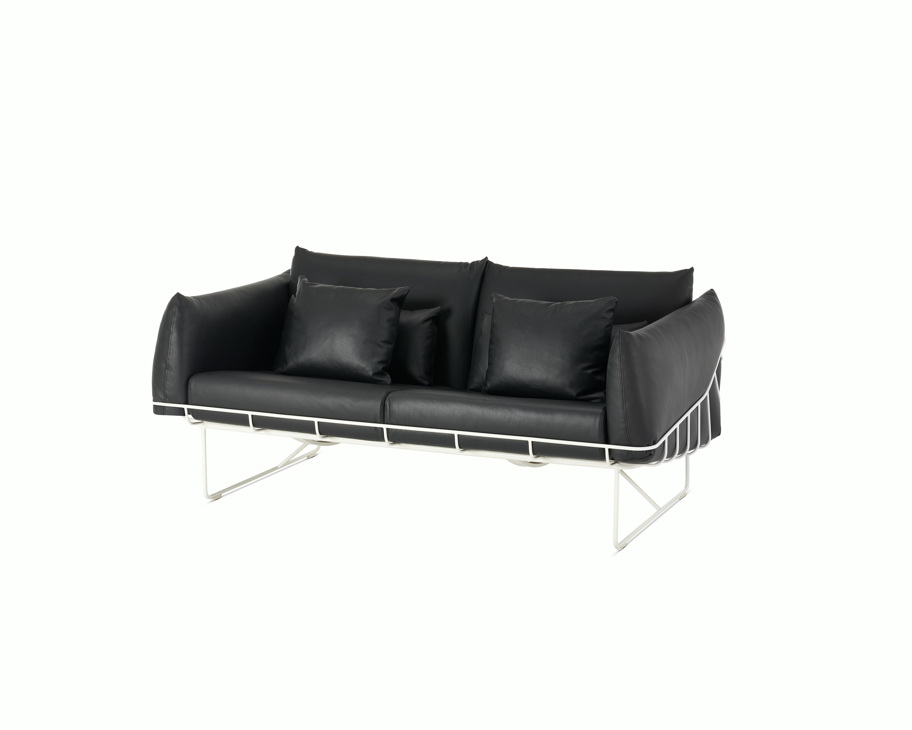Wireframe Sofa Two Seater with black leather cushions and white frame. 