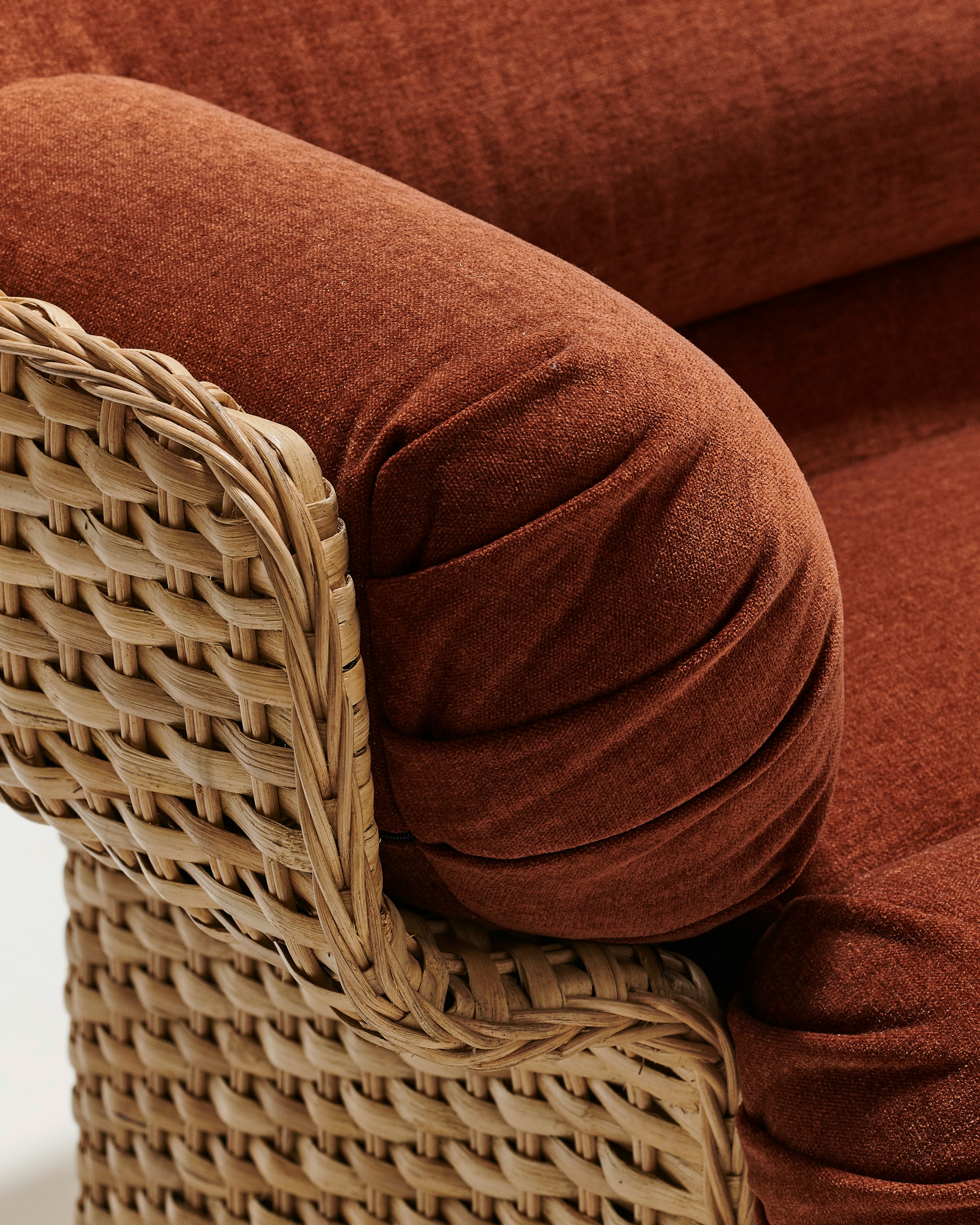 A detailed look at Basket Lounge Chair in Rust, Rattan.